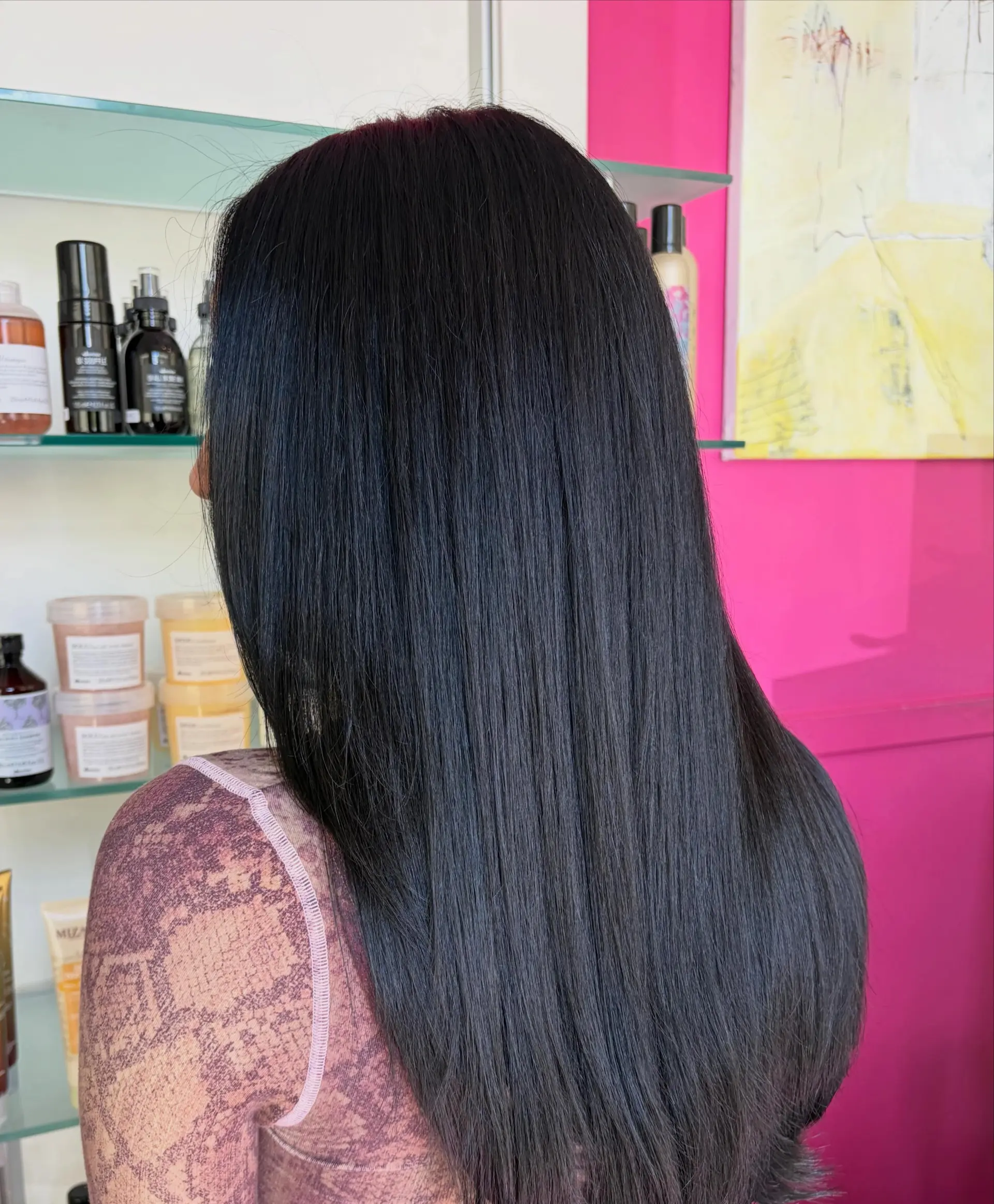 Long, ultra-glossy straight hair dyed a rich blue-black shade with soft, subtle layered ends. 1