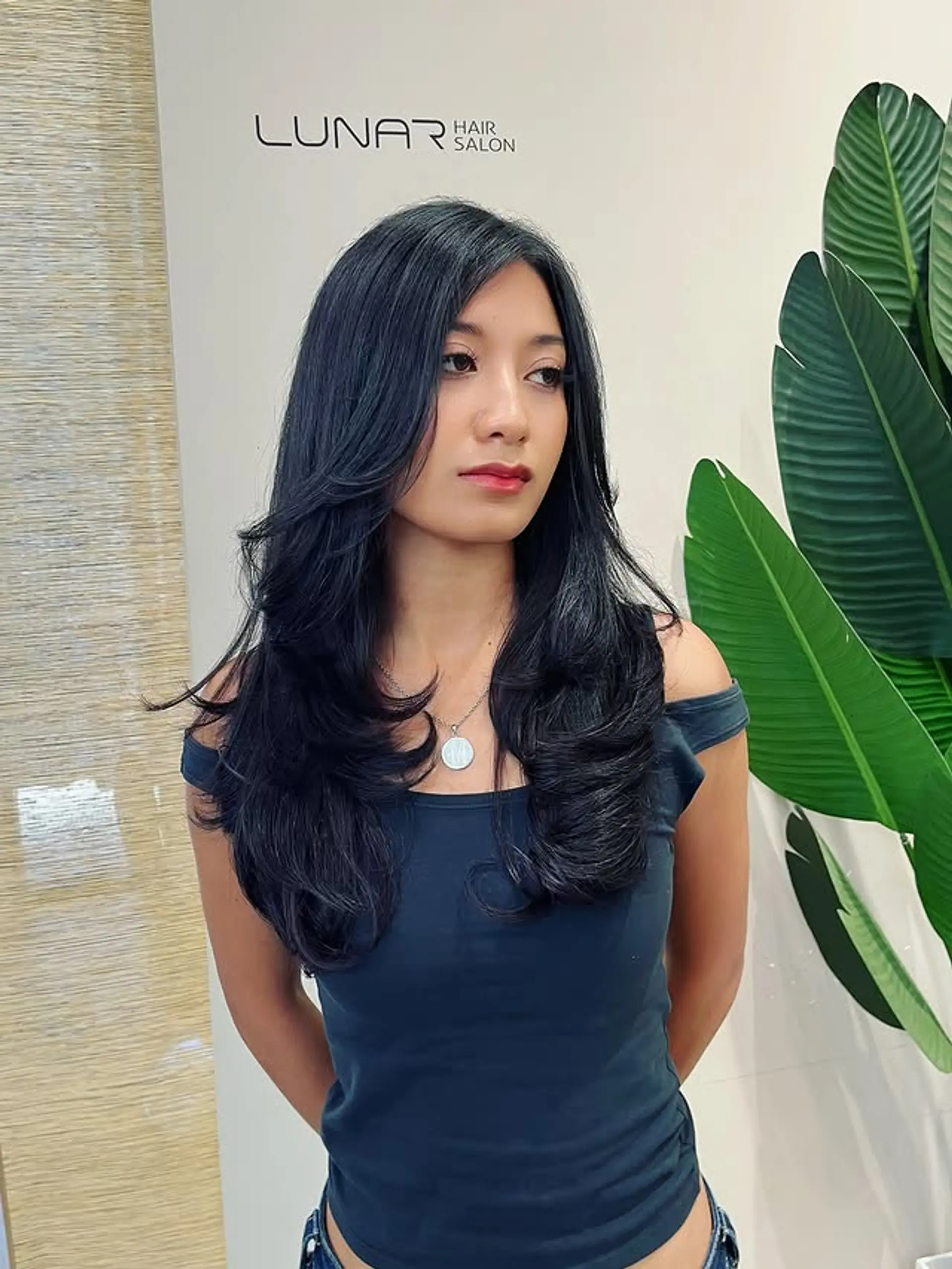 A long layered butterfly cut, designed to add volume and movement with face-framing layers. 1