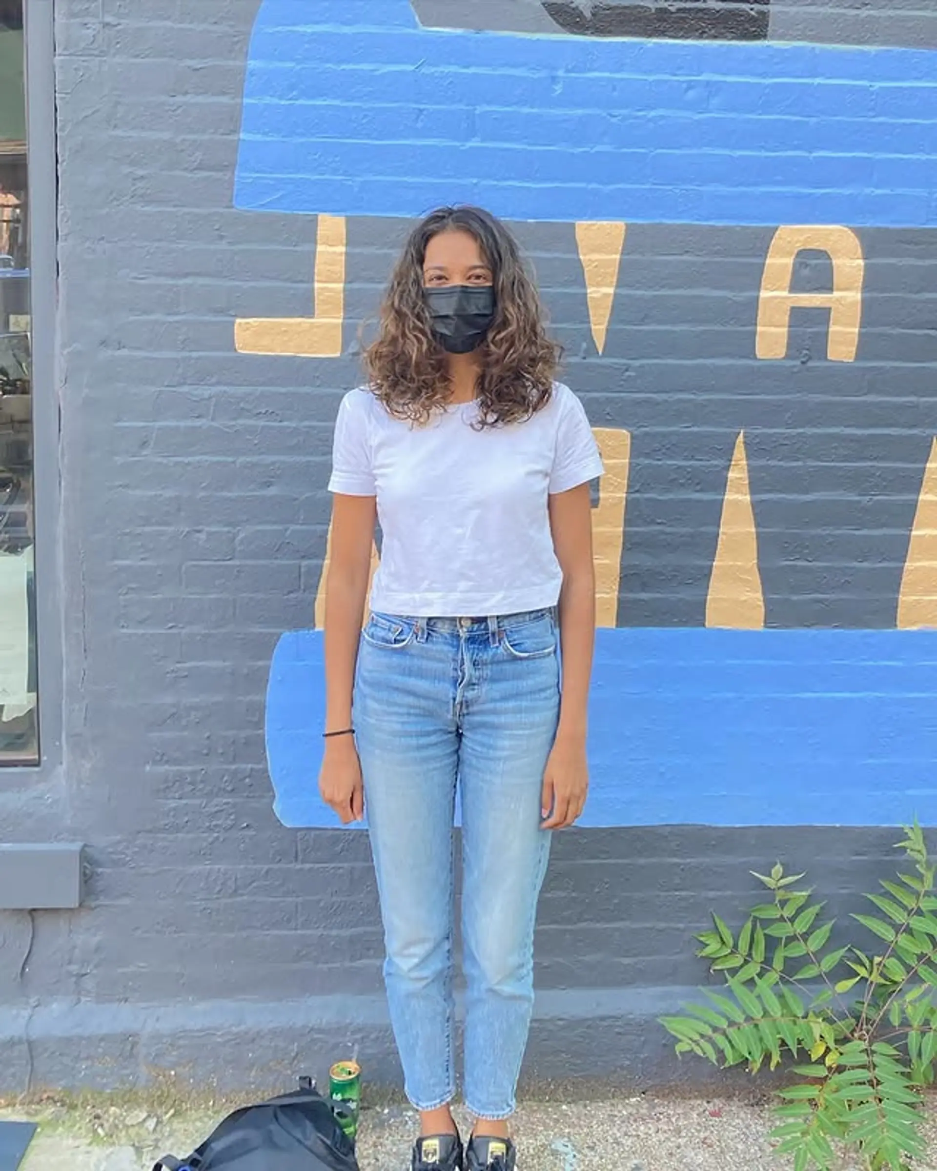 A curly shag haircut with medium length, emphasizing natural texture and movement. 1