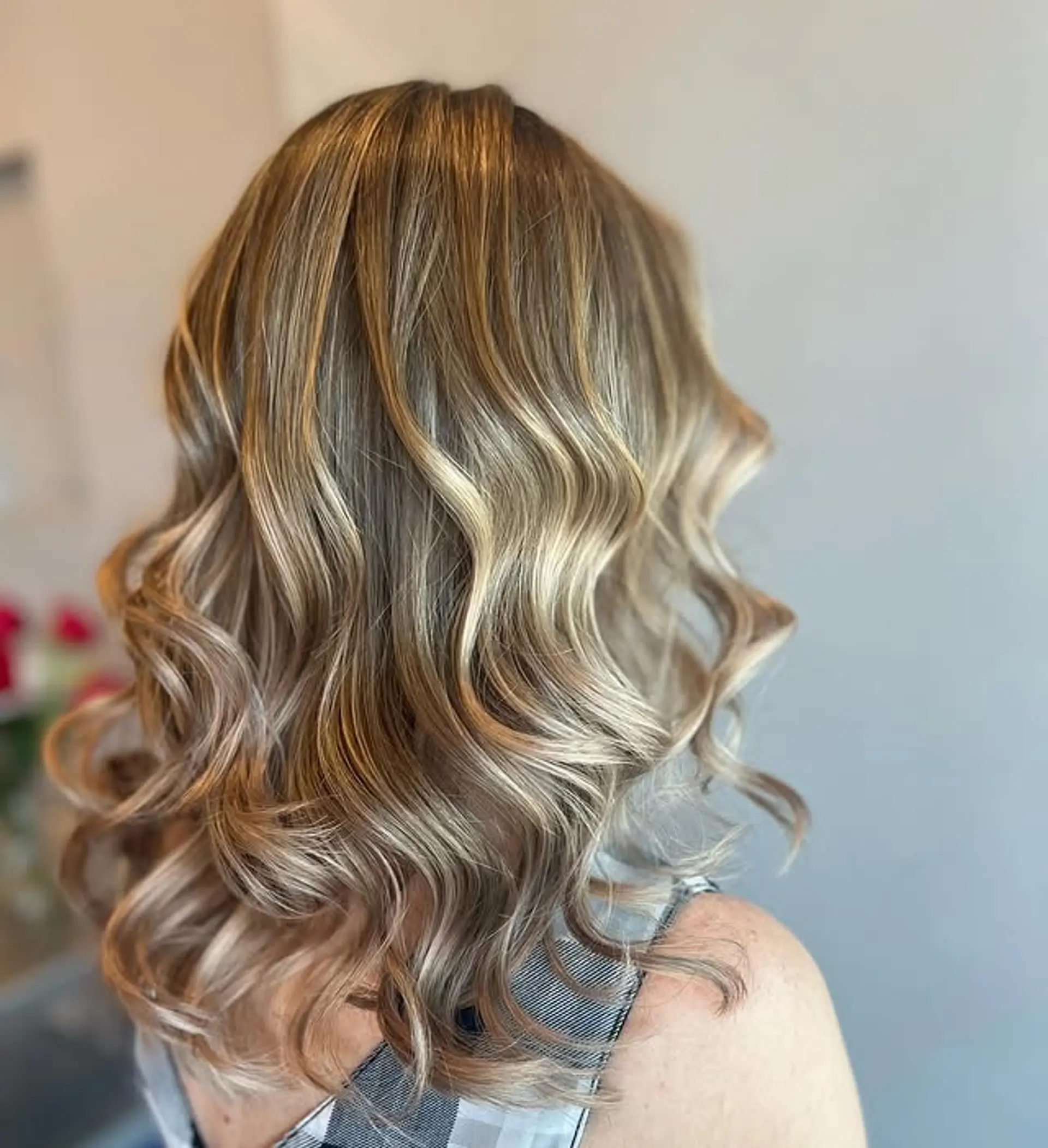 Wavy medium-length hair with a golden blonde balayage and soft waves. 1