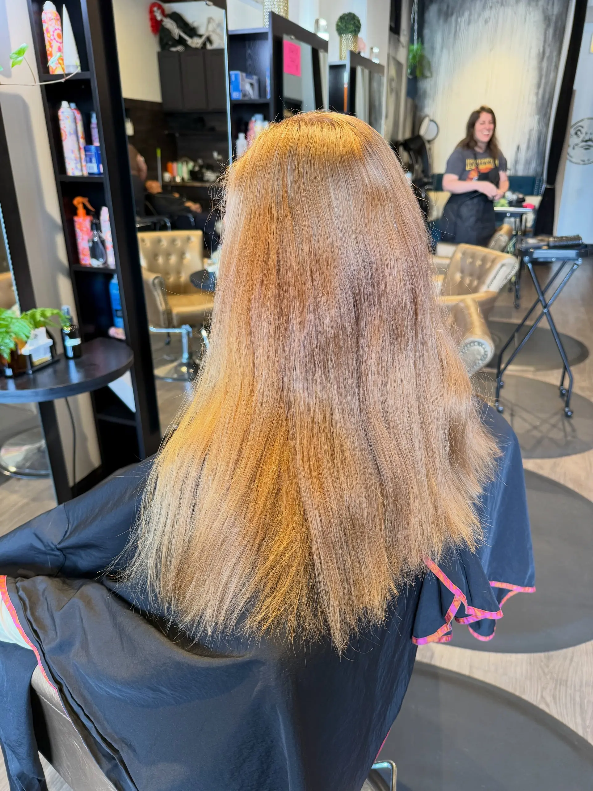 Long, straight strawberry copper hair enhanced with dimensional foiled highlights. 1