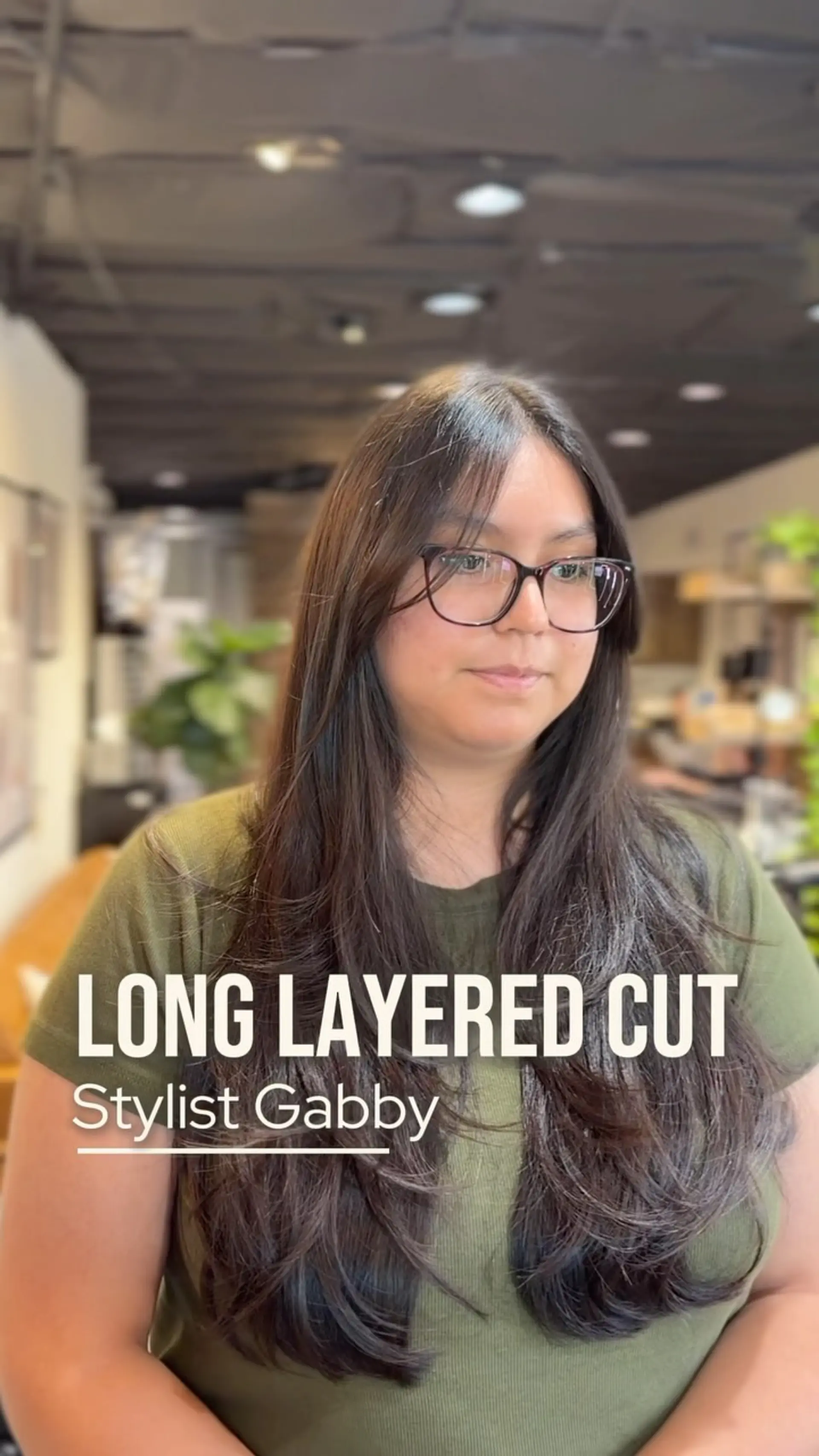 Long dark brown hair styled with soft, cascading layers and curved ends. 1