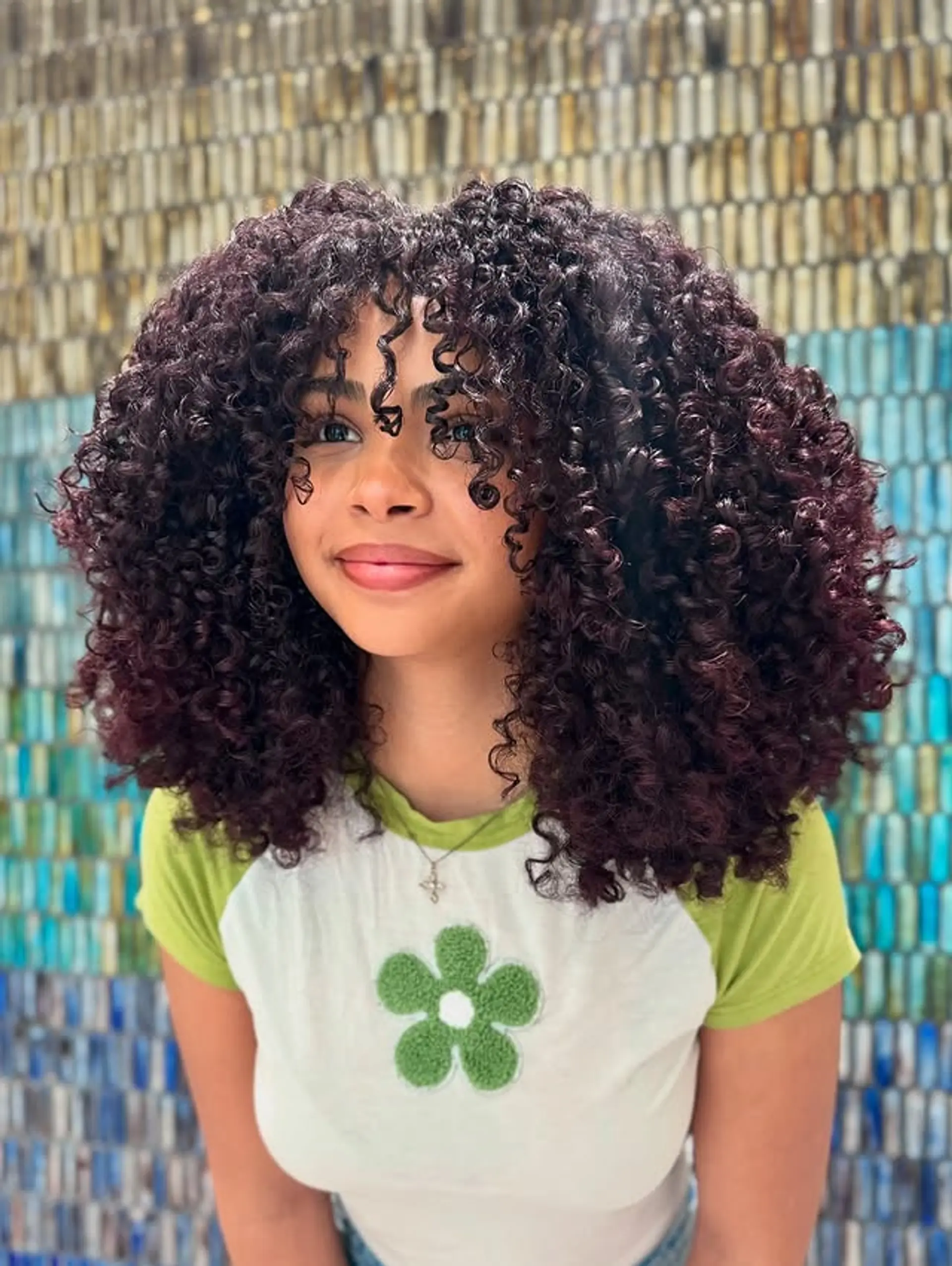 A medium-length, curly shag with bangs. 1