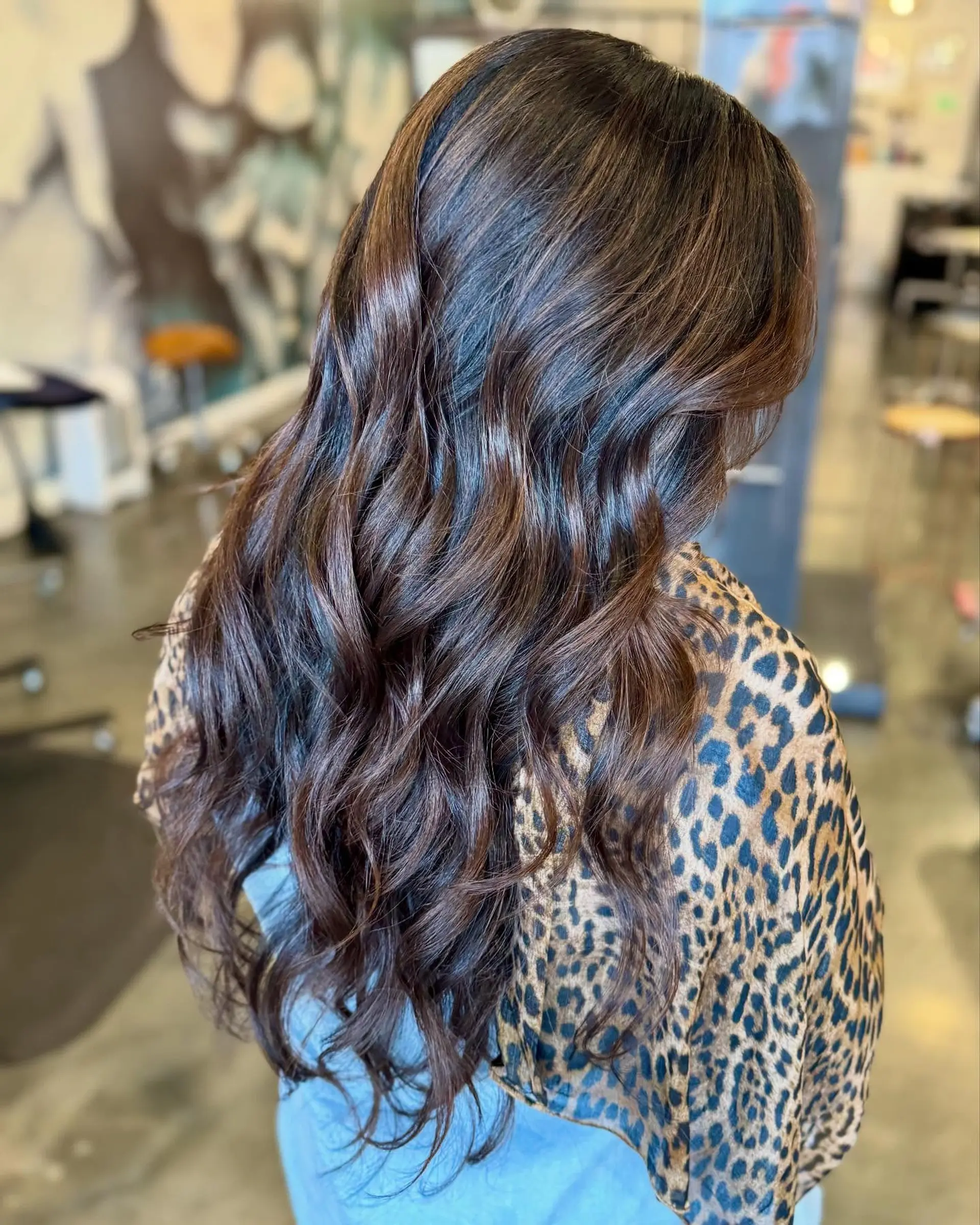 Long, layered, wavy hairstyle with a voluminous and romantic style. 1