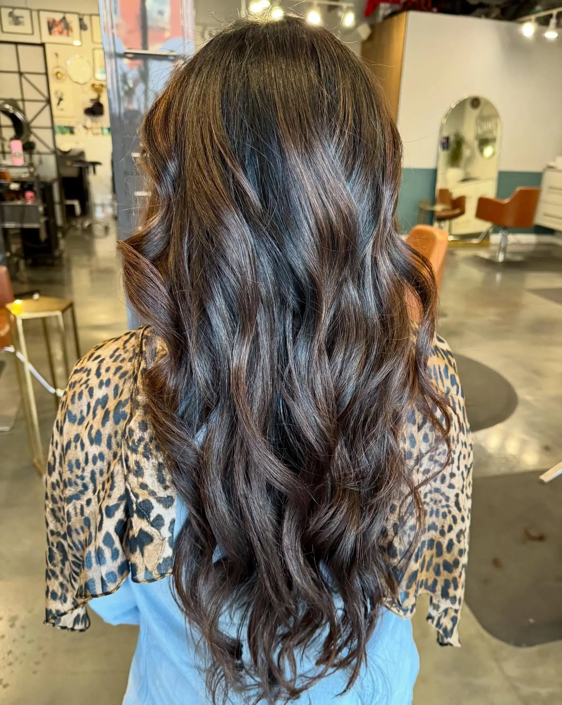 Long, layered, wavy hairstyle with a voluminous and romantic style. 2