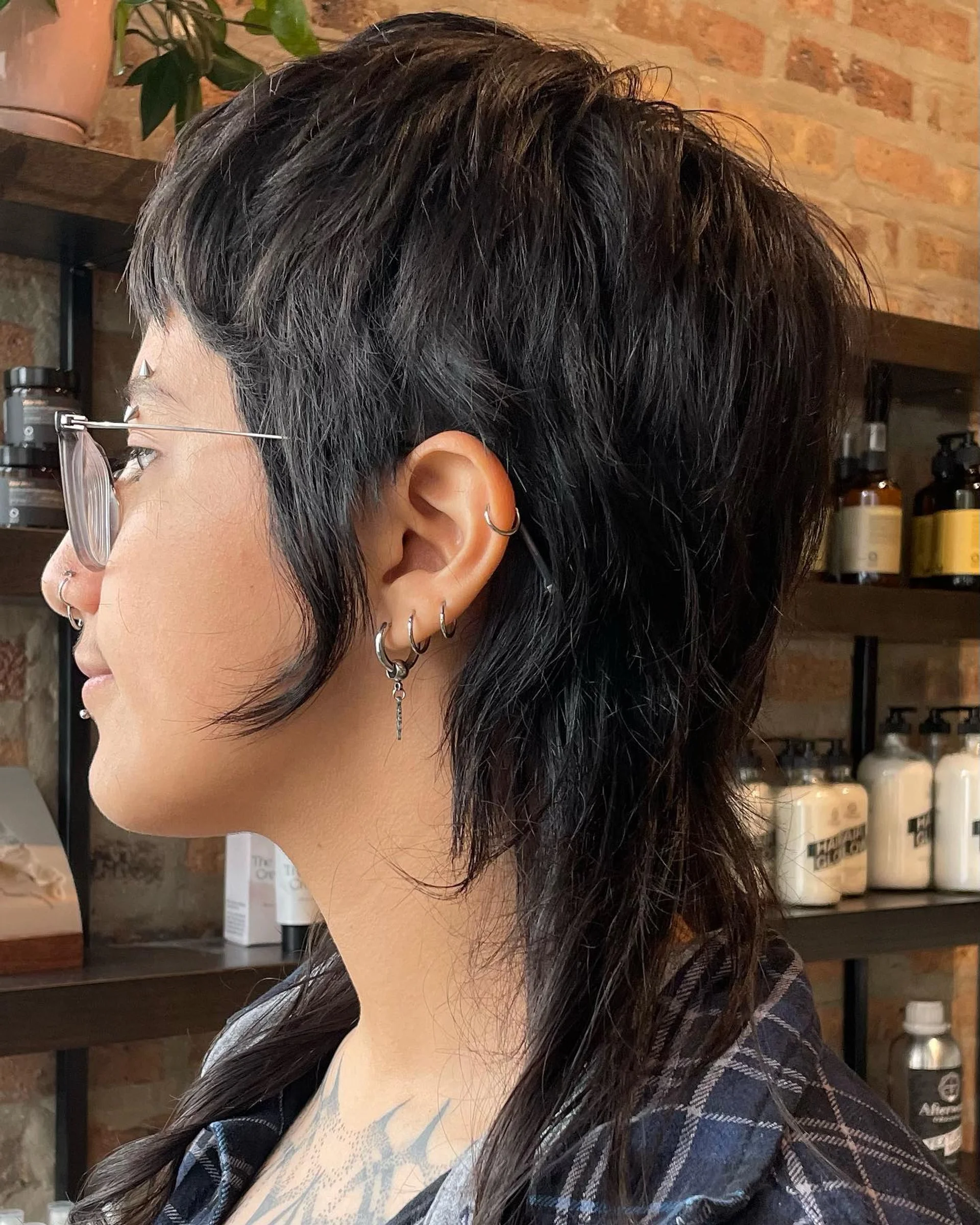 A sleek, short bob with textured layers, showcasing modern styling versatility. - Preview 3