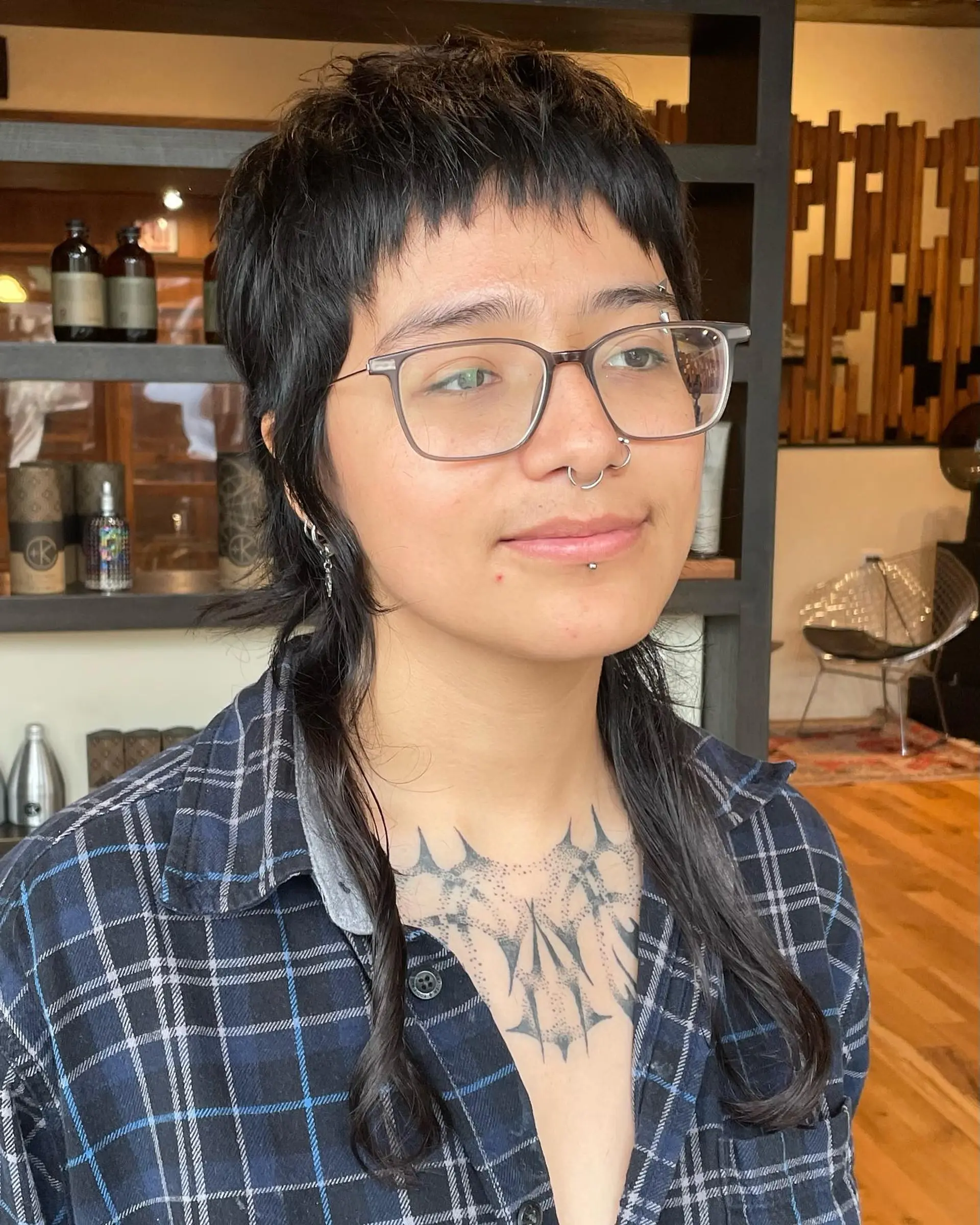 A modern, edgy mullet with short, choppy layers on top and longer layers in the back, creating a shaggy, textured look. 2