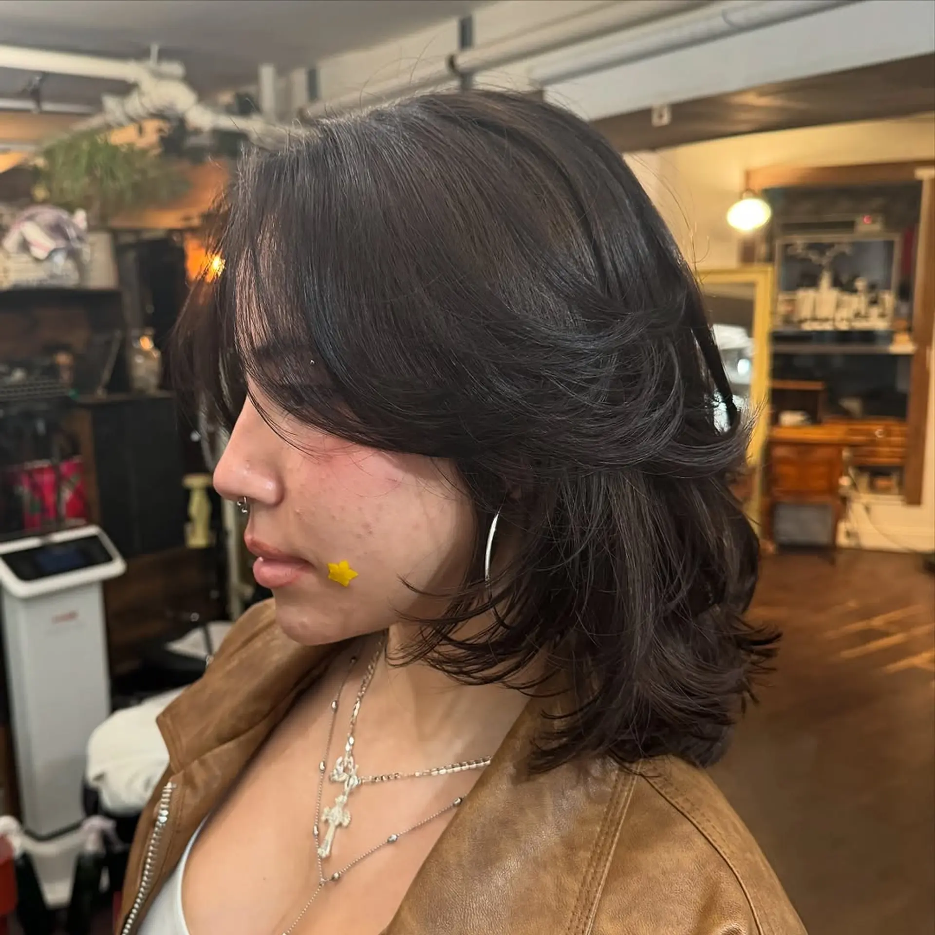 Medium-length shag cut with heavy face-framing layers, soft internal layering for volume, and long, blended curtain bangs. 1
