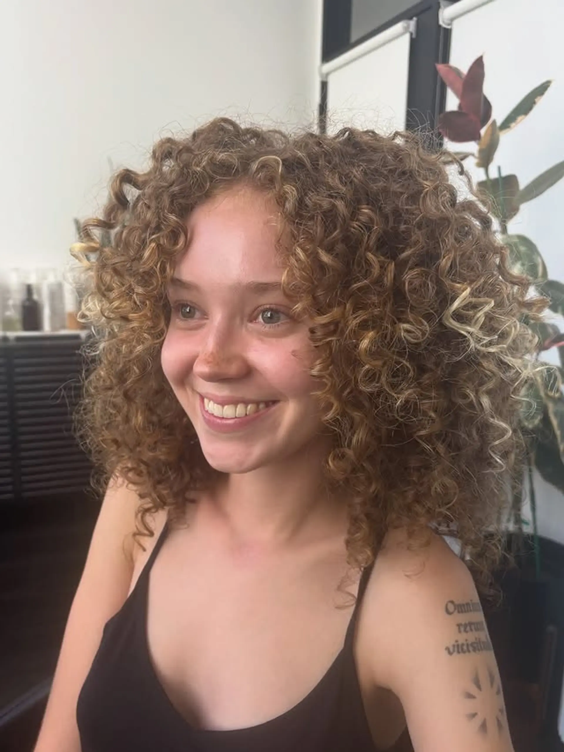 A bouncy medium length curly bob with a defined and voluminous shape. 1