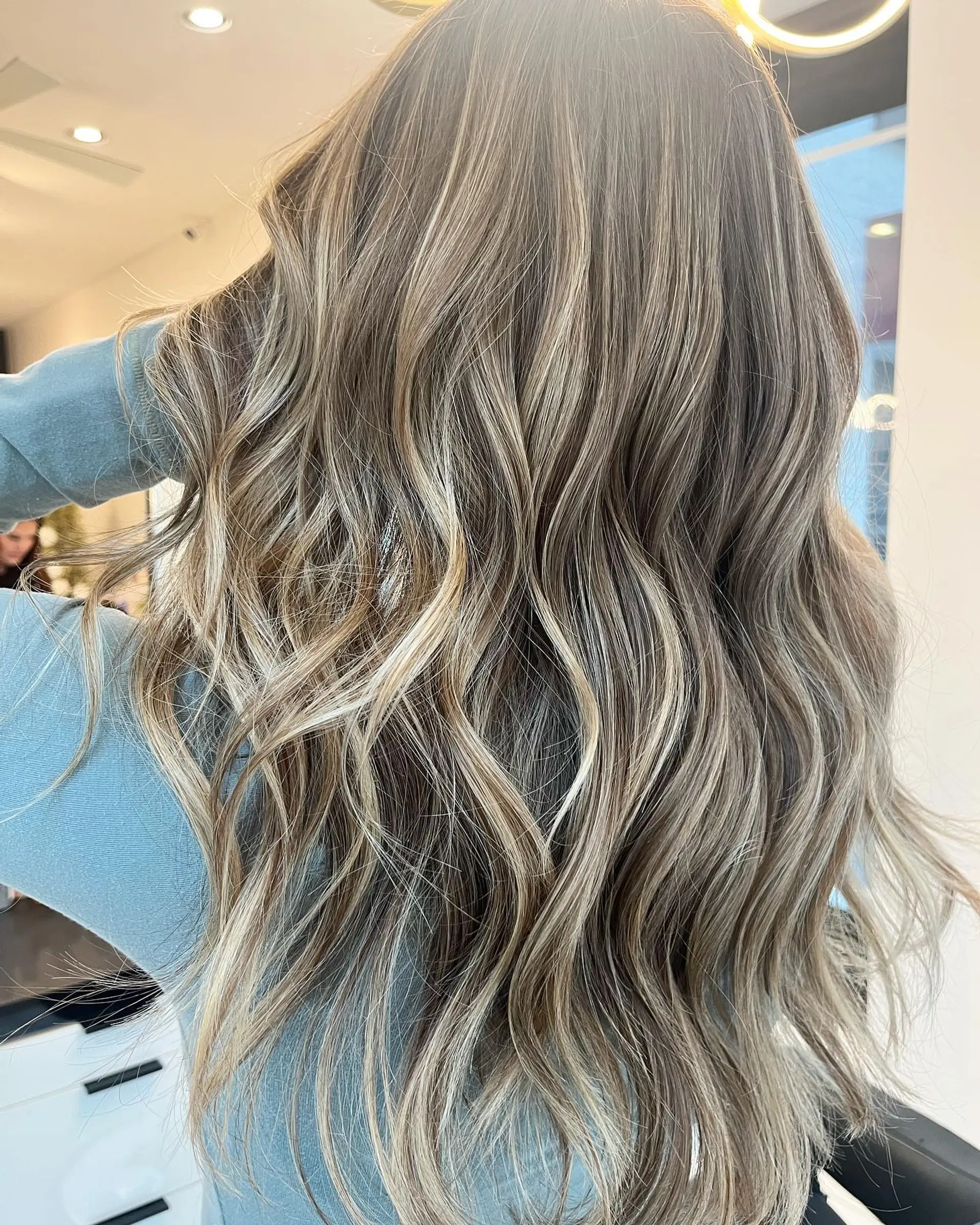 Long, wavy hair with a brown base and blonde balayage highlights. 1