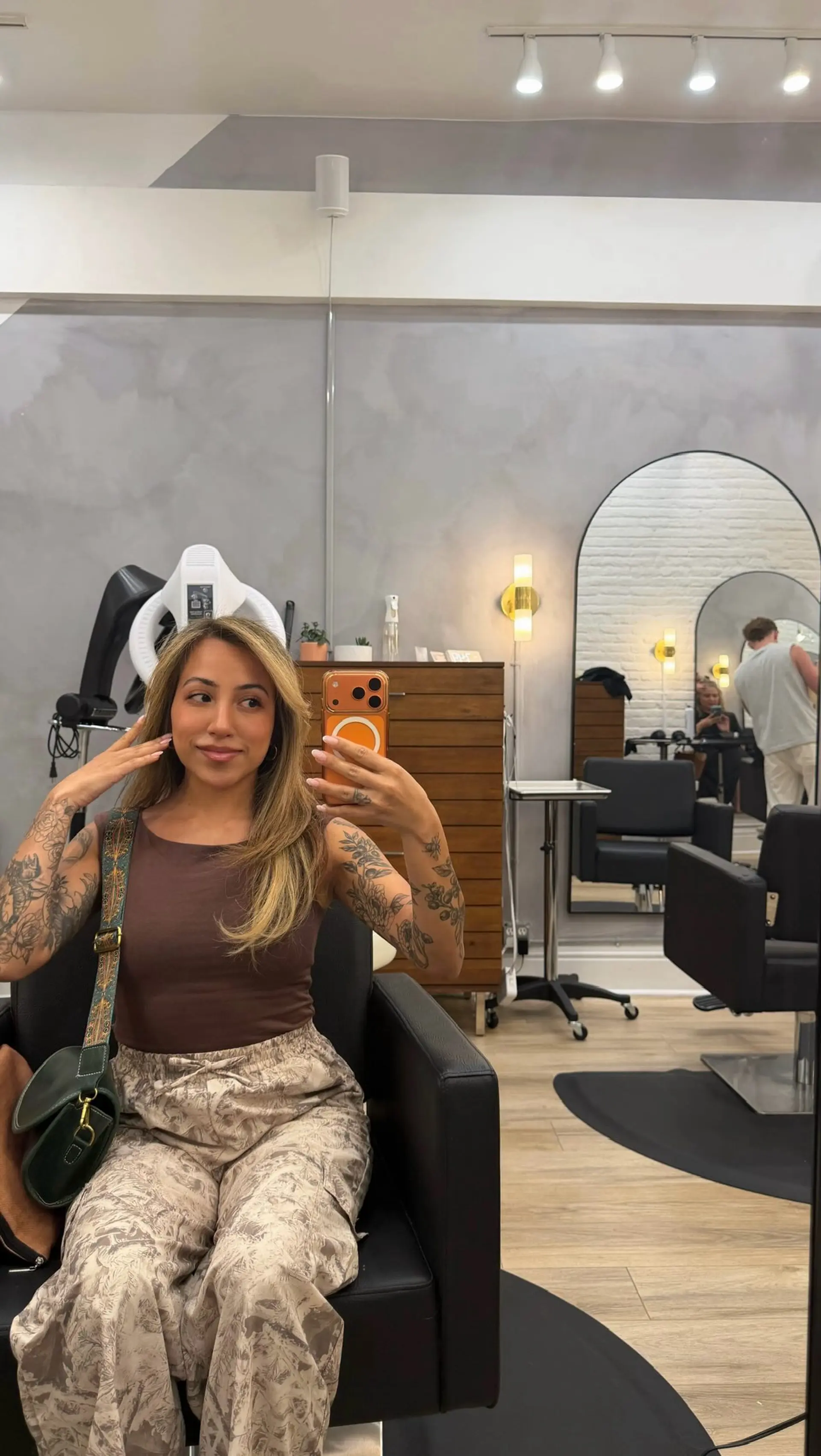 Long honey blonde hair featuring seamless dimensional highlights and face-framing layers styled in a soft, smooth blowout. 1