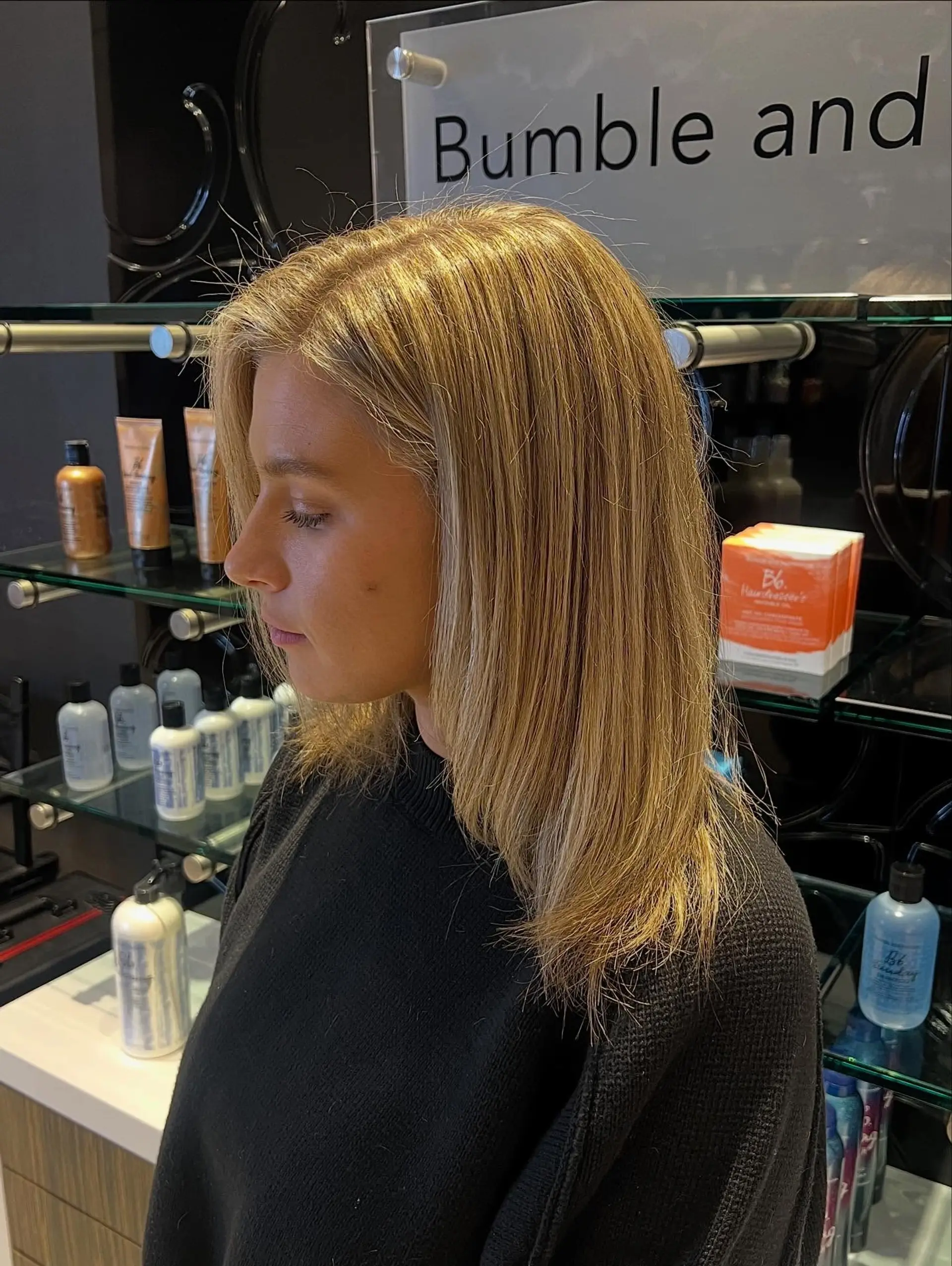 Medium-length straight hair featuring warm, multi-dimensional golden blonde highlights and a smooth finish. 1