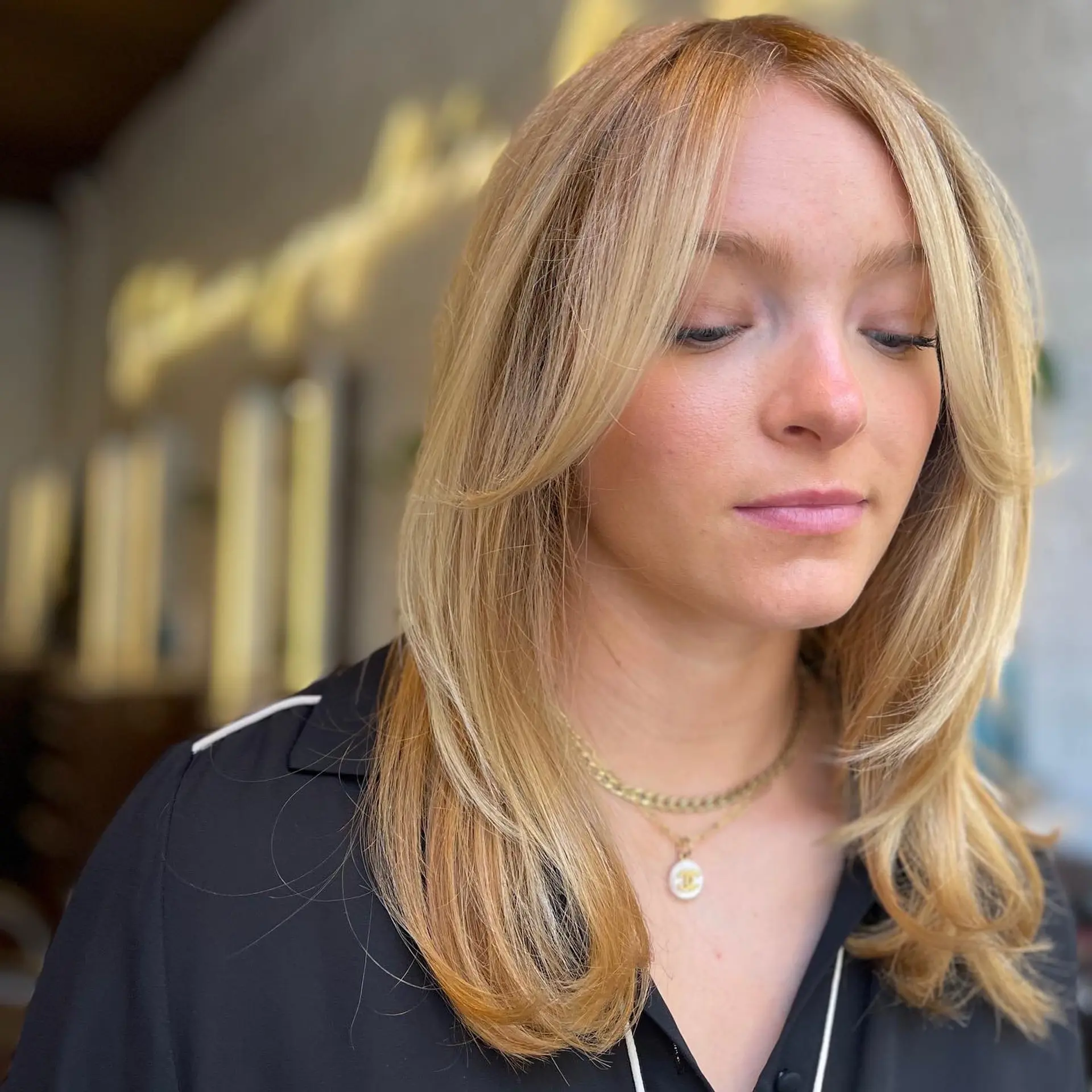 A medium-length cut with curtain bangs and face-framing layers. 1