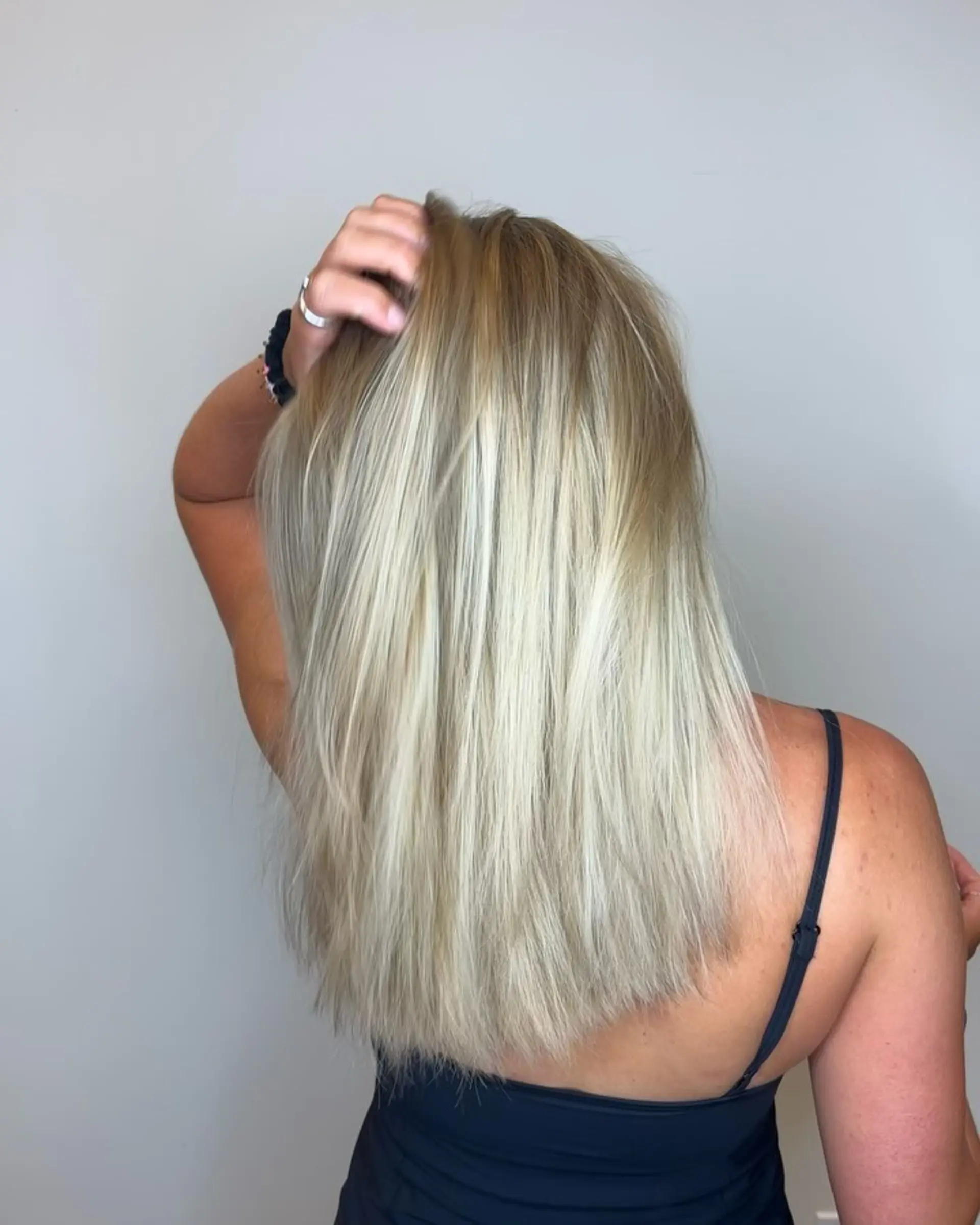 Smooth, straight medium-length hair with a dimensional blonde blend featuring root shadowing and bright ends. 1