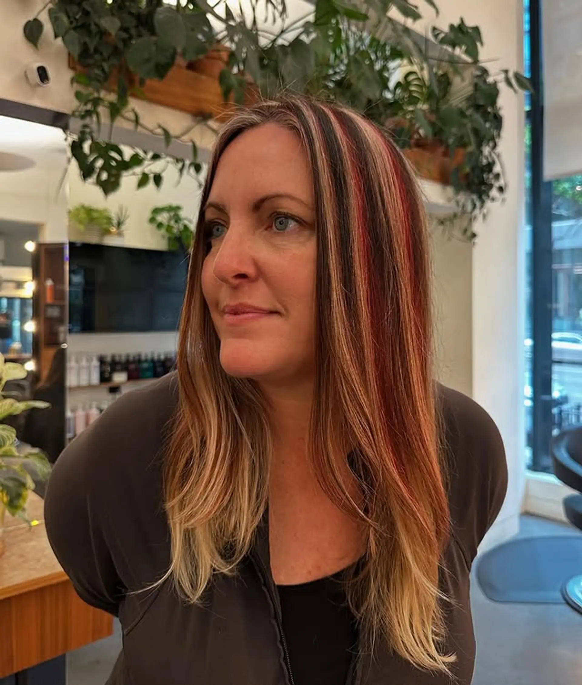 Long straight hair with face-framing blonde highlights and red streaks. 1