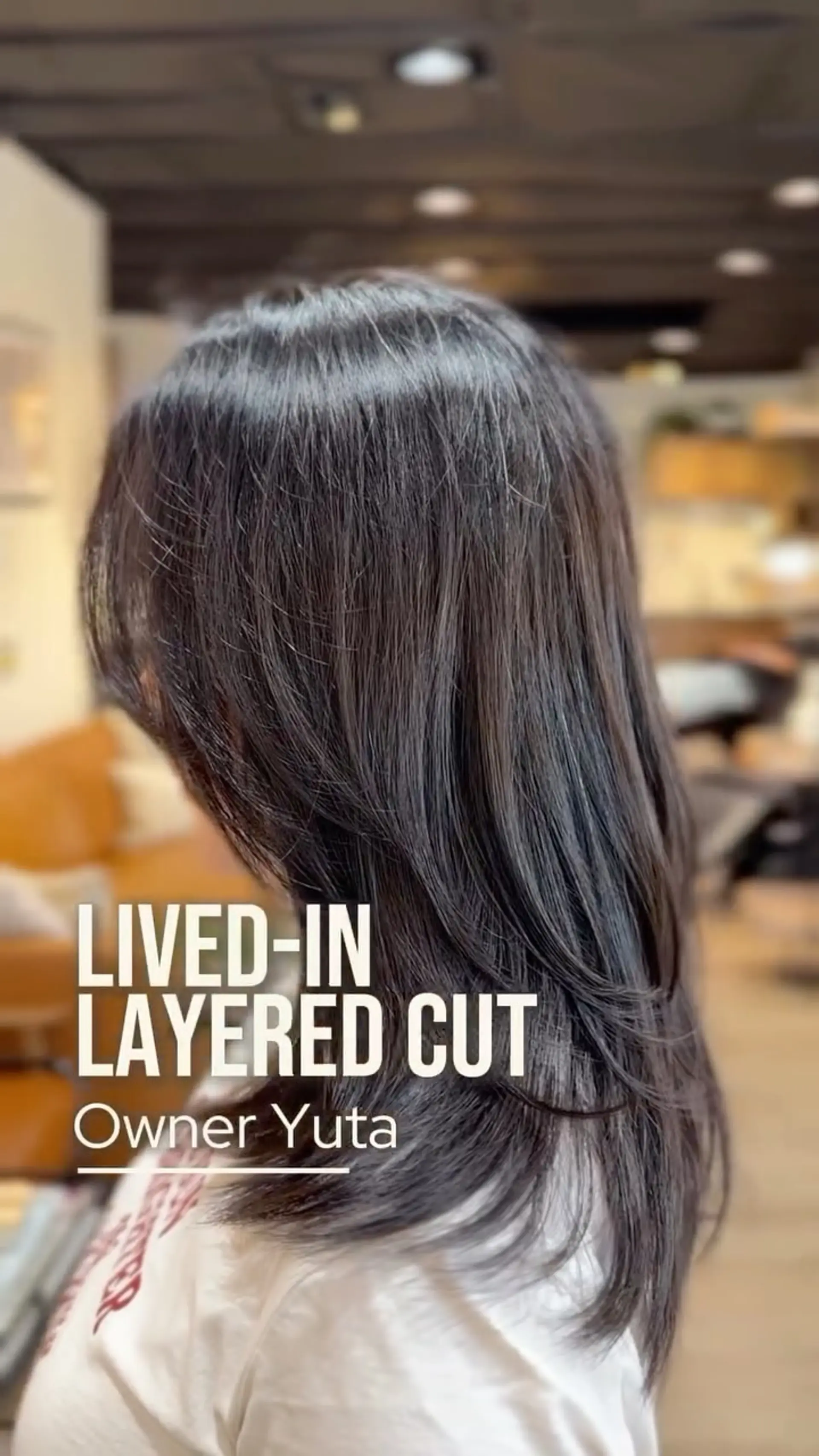 A long, smooth lived-in layered haircut with soft texturing that enhances movement and dimension. 1