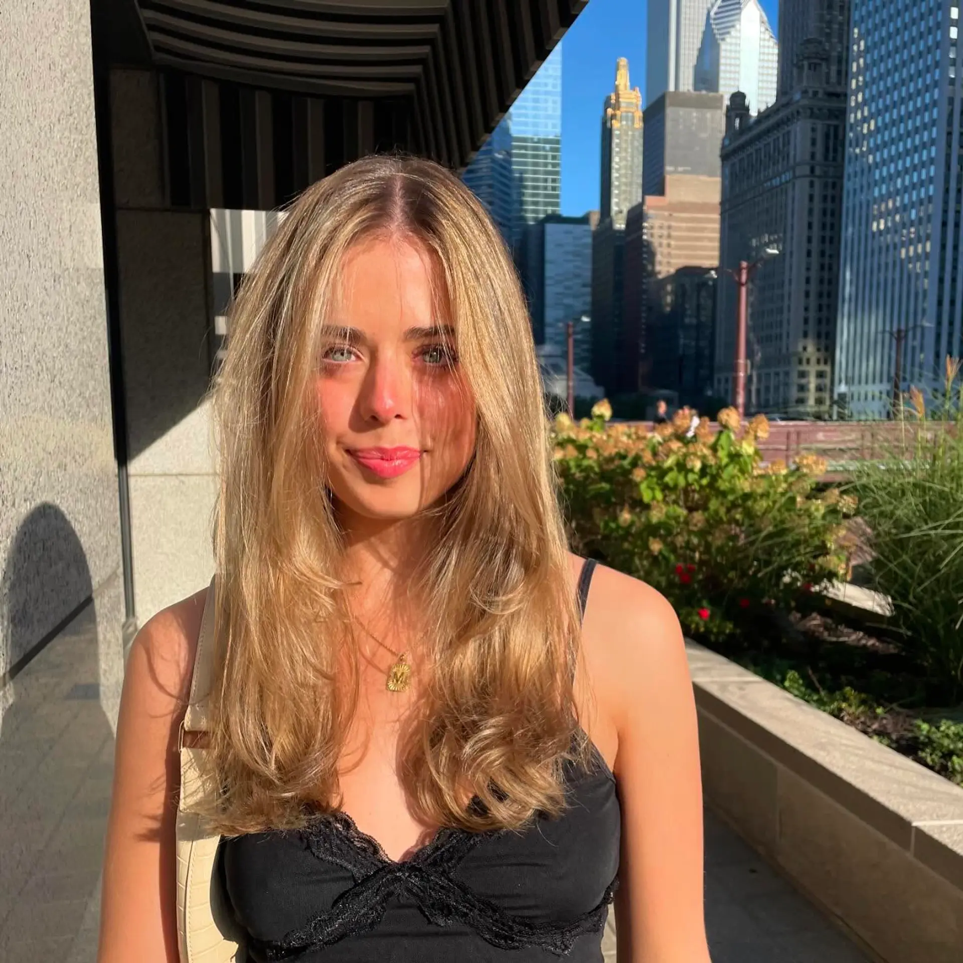 A long, layered cut with face-framing pieces and natural texture, styled with soft waves that add volume and movement throughout the hair. 1