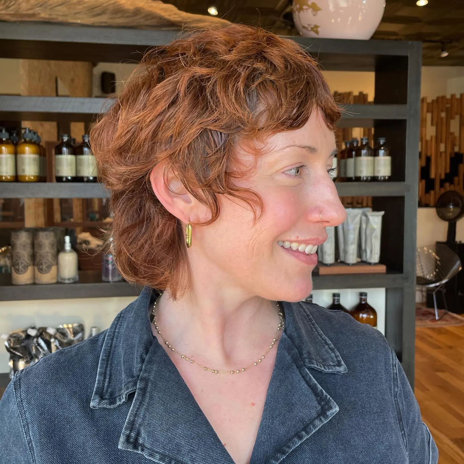 A short, layered shag haircut designed to enhance natural curls. 2