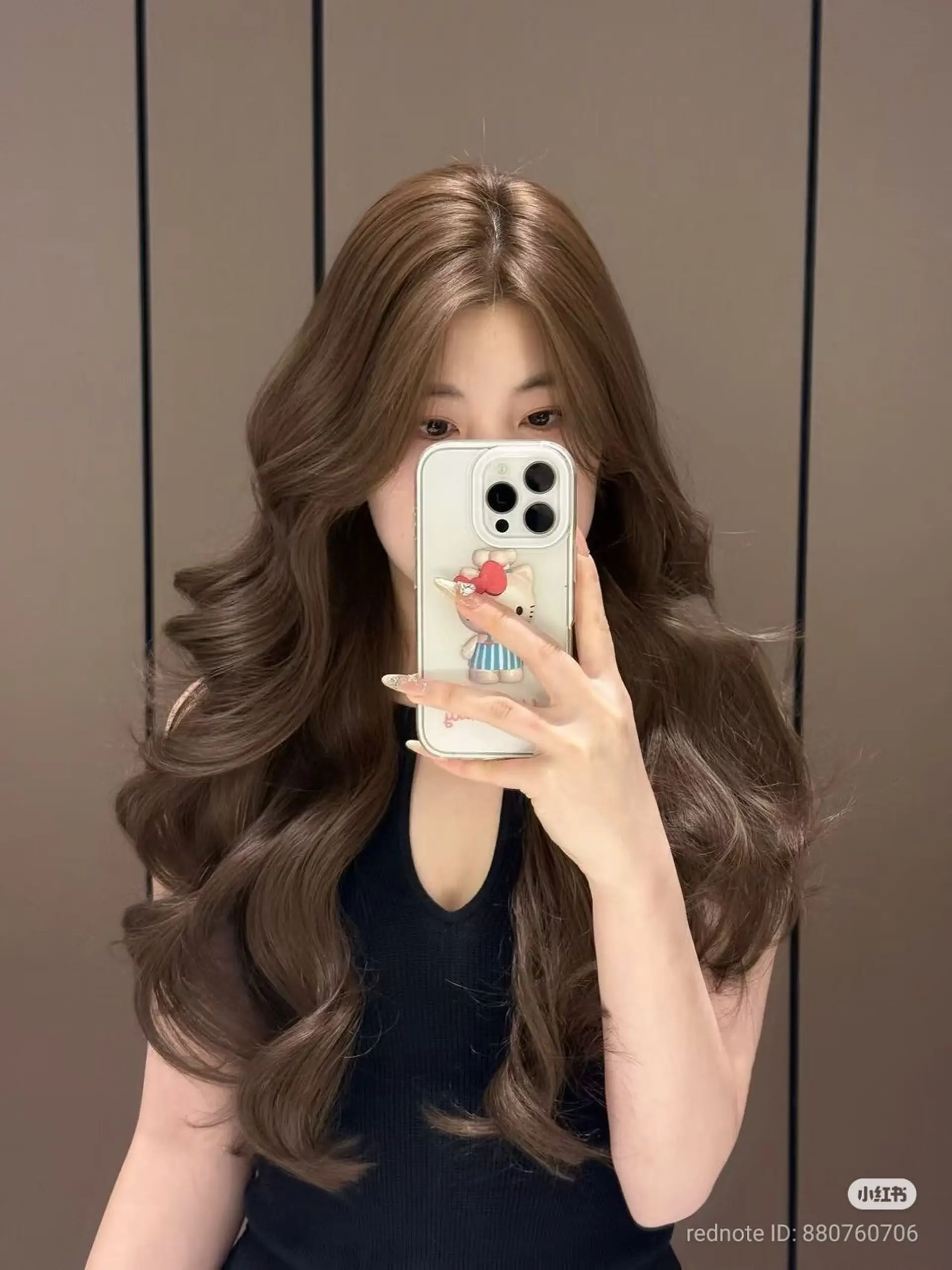 Long, voluminous brown waves with face-framing layers. 1