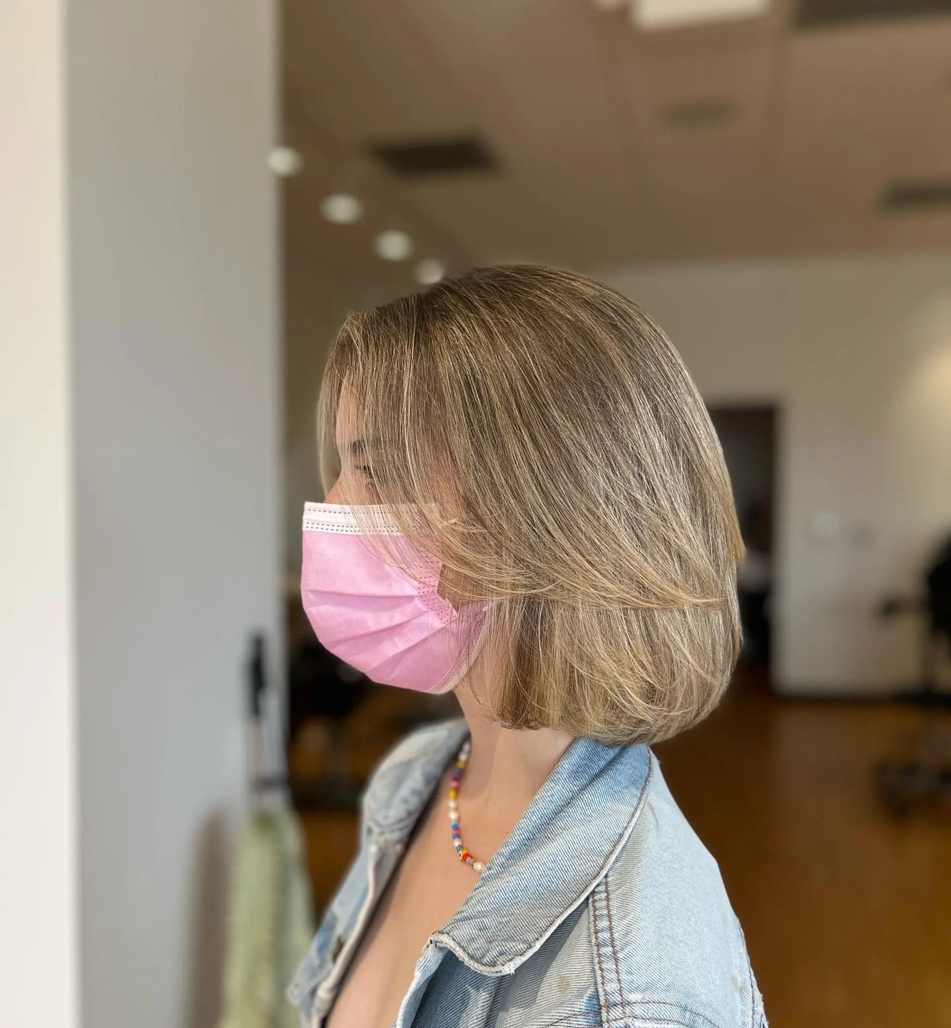 A textured chin-length layered bob with soft, sweeping face-framing layers and dimensional blonde highlights. 1