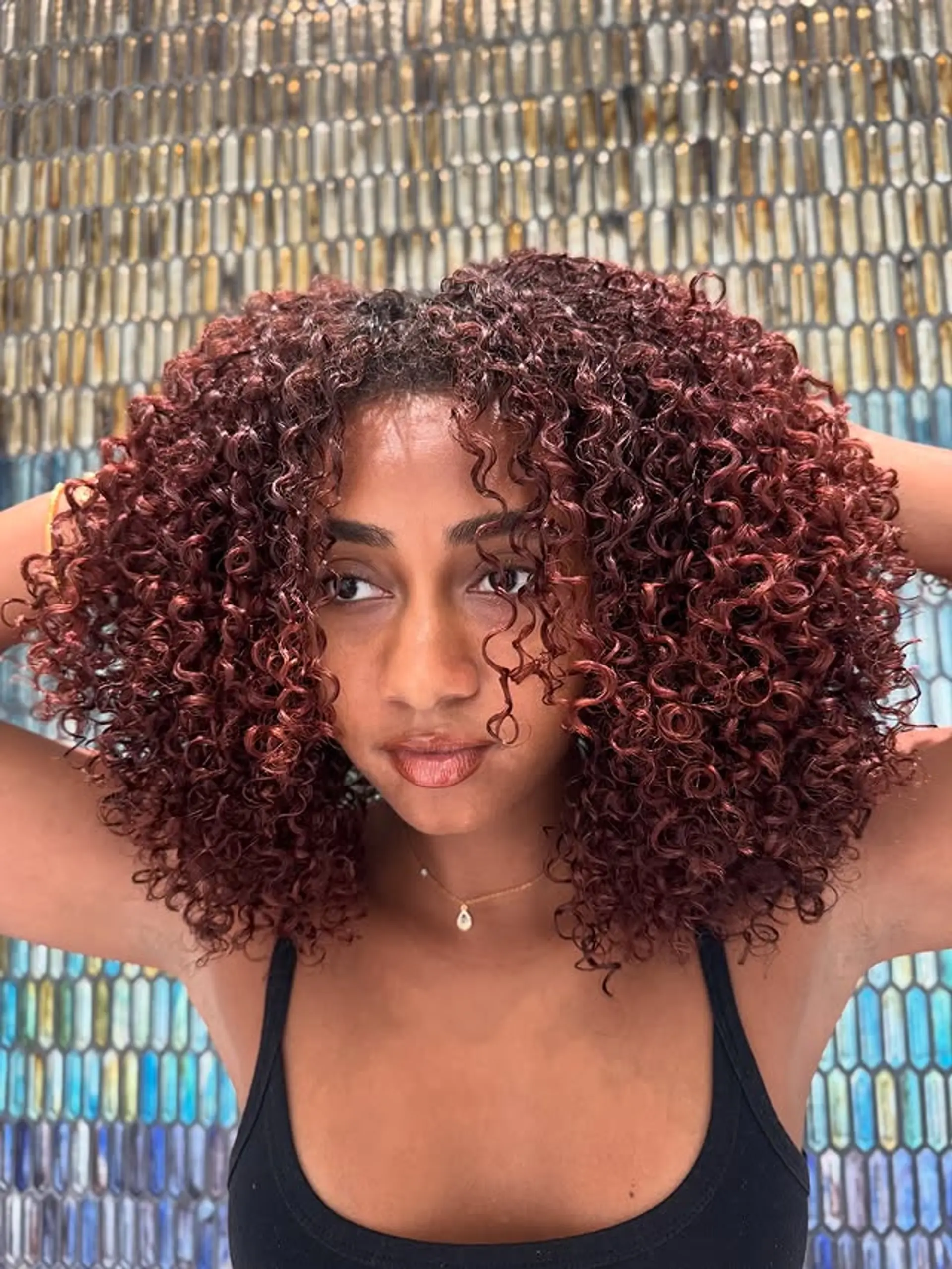 A gorgeous medium-length curly hairstyle with defined, bouncy curls. 1