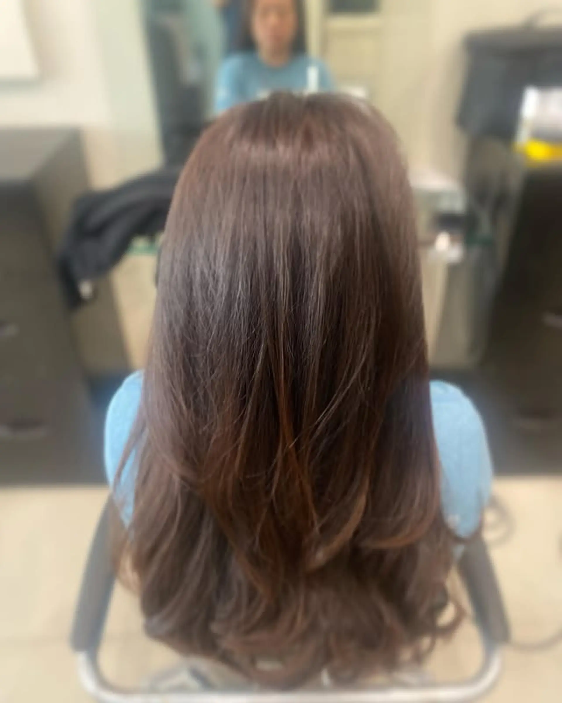 A beautiful long hairstyle with soft layers that create gentle waves and movement. 1