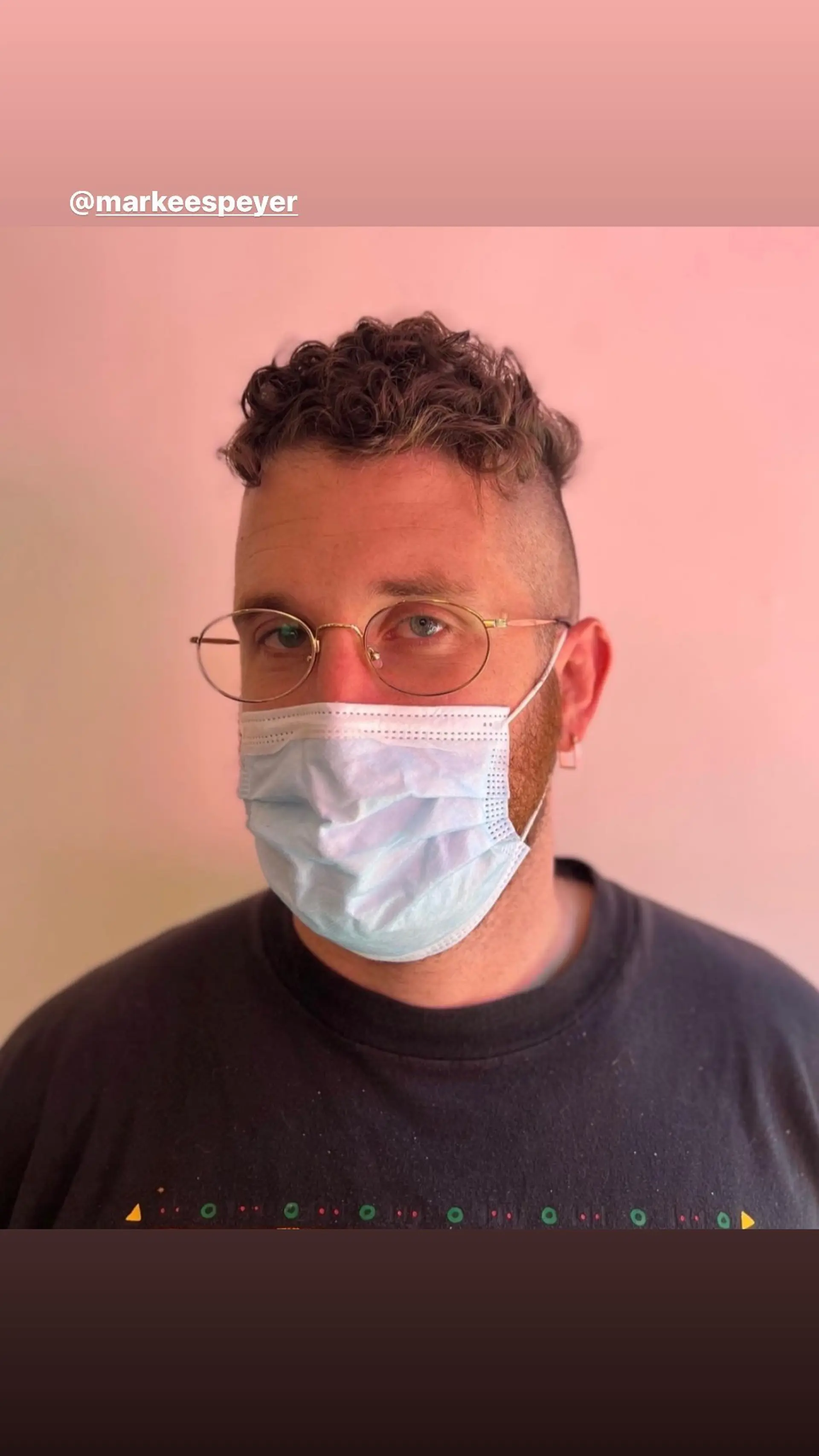 A modern take on the classic fade featuring curly hair on top. 1