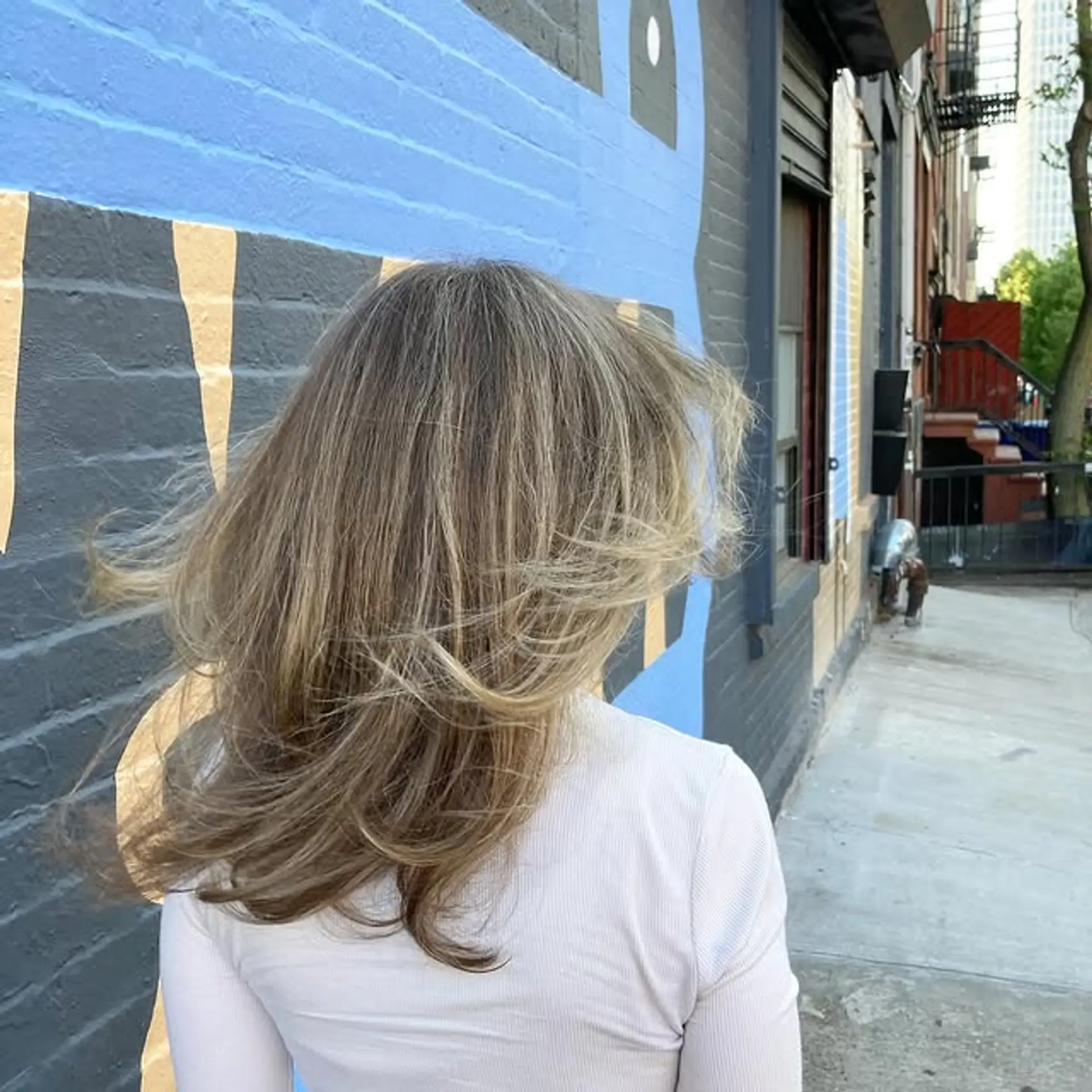 A medium-length, layered bronde balayage with face-framing layers. 1