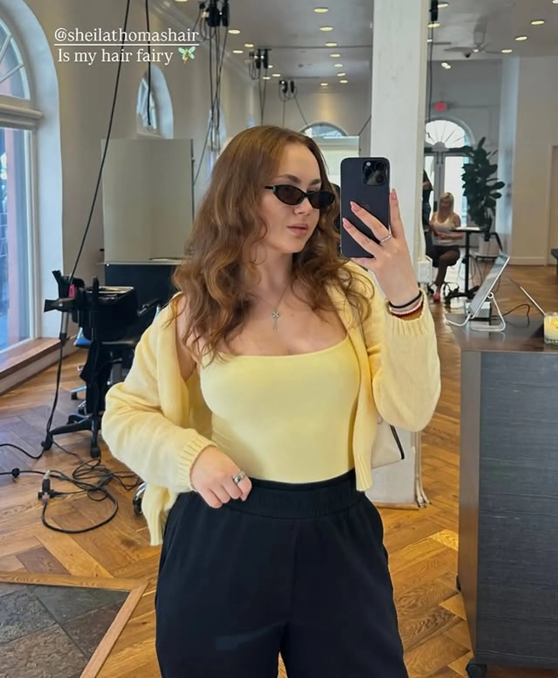 Medium length, bronzed brown wavy hair with beachy waves and layers. 1