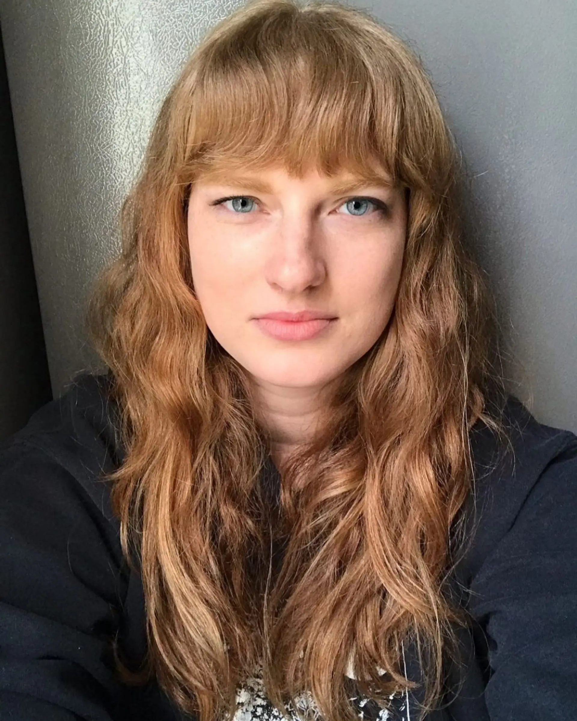 Long wavy hair with textured bangs. 1