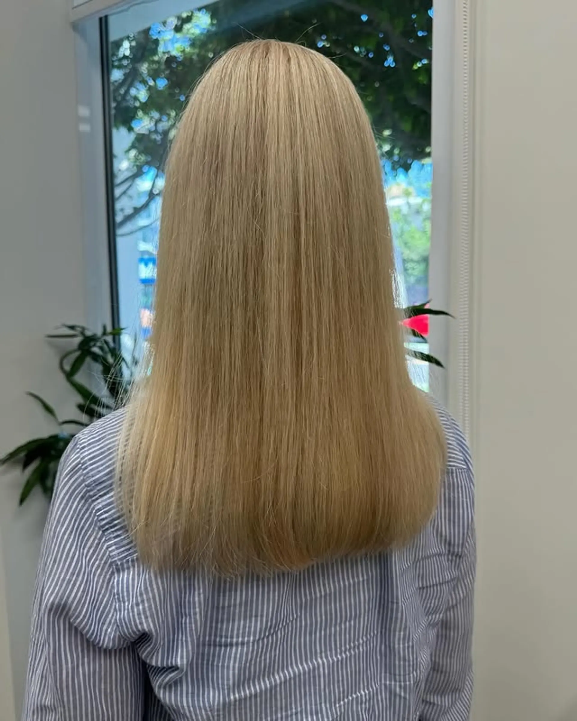 A classic long hairstyle featuring silky, straight hair. 1