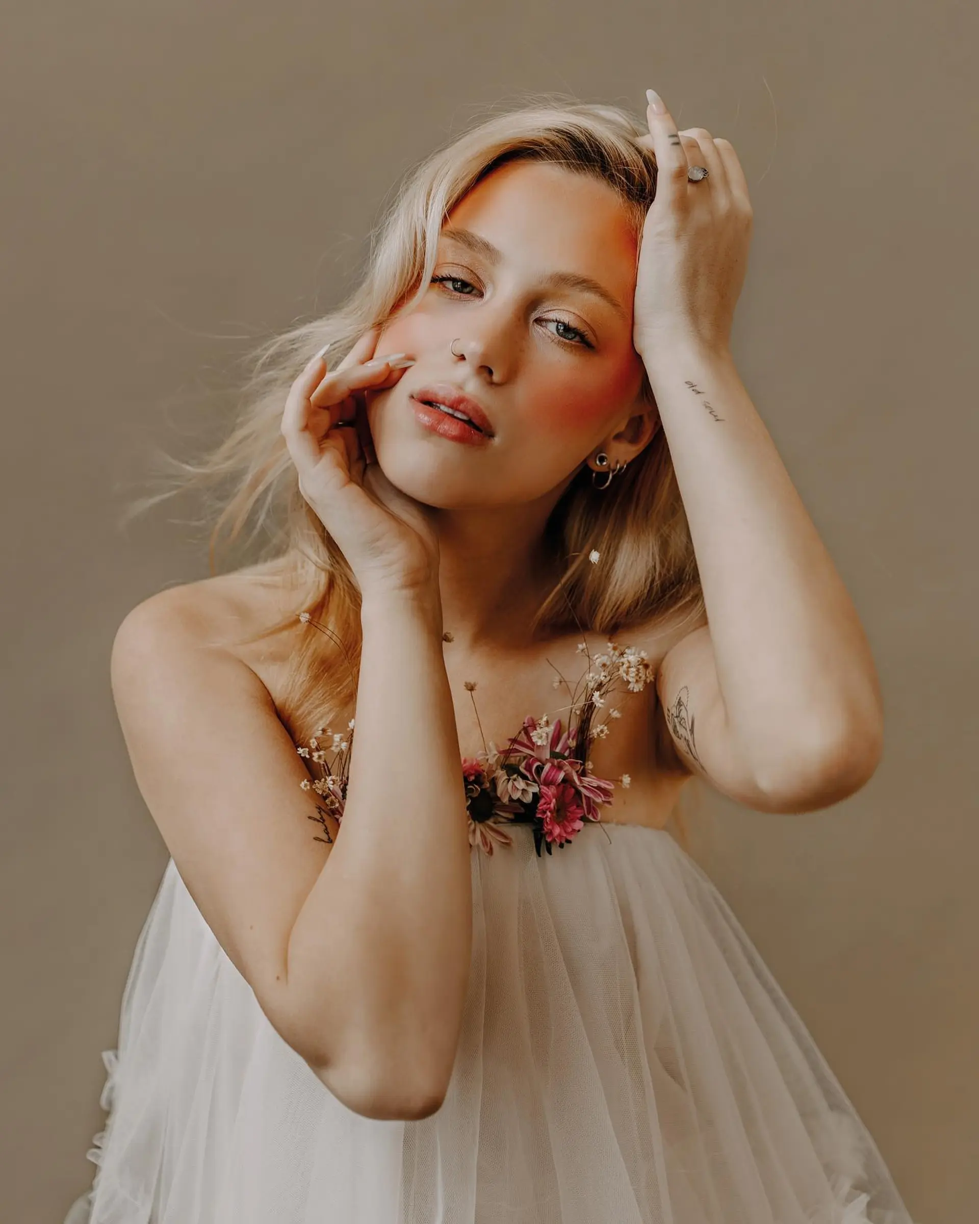 Airy, tousled light blonde hair styled with soft, natural texture and gentle movement. 1
