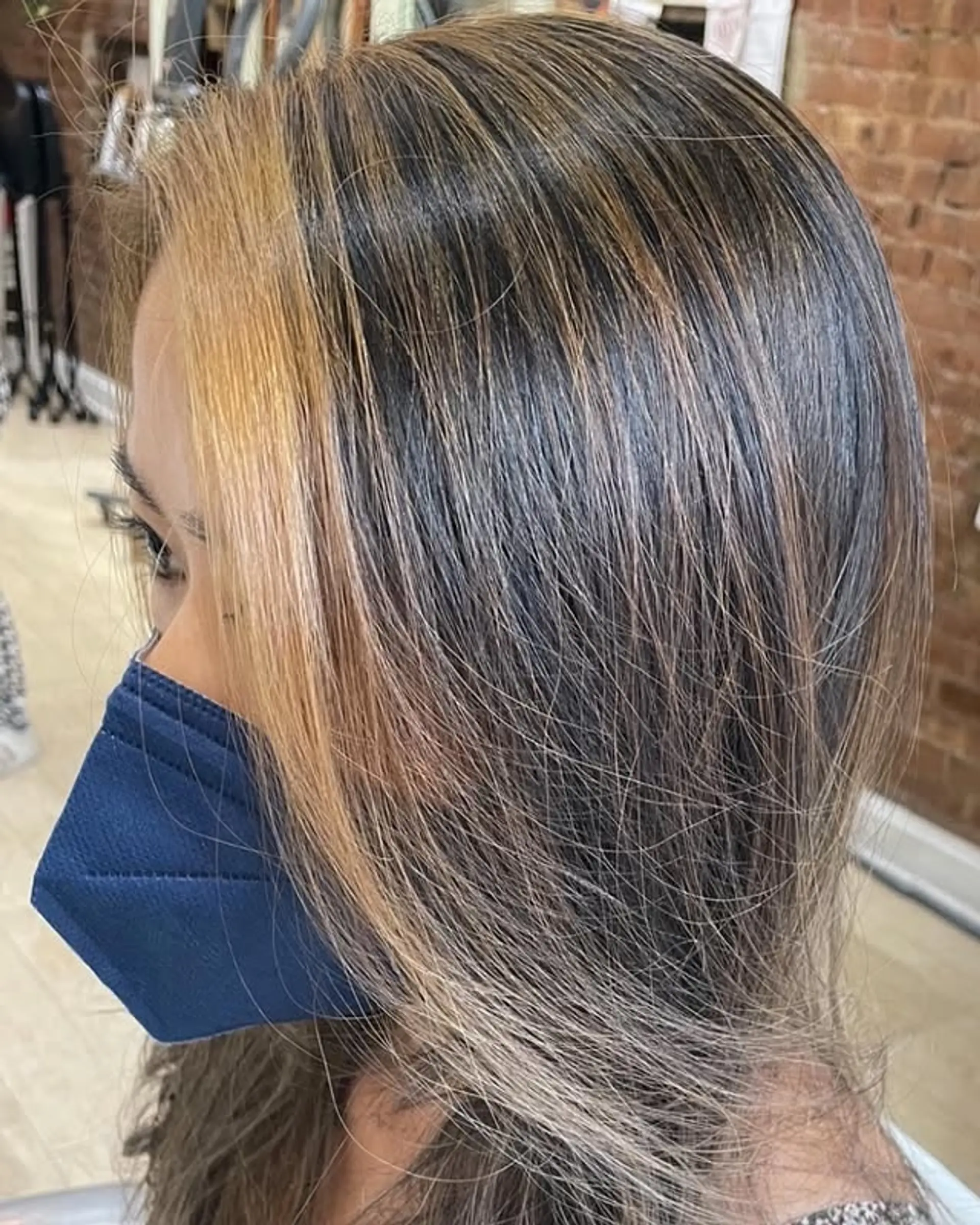 Long straight hair with face-framing money piece highlights. 1