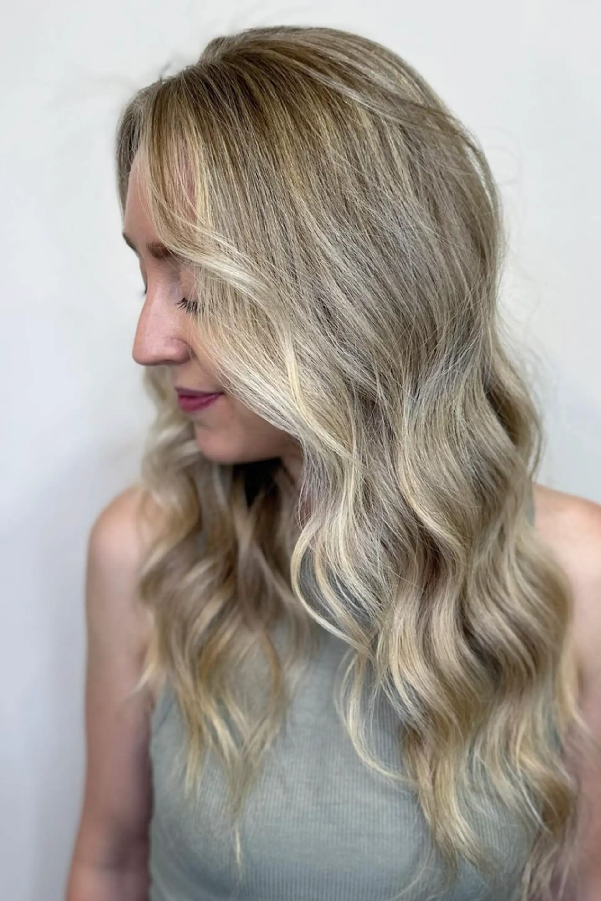 Long wavy blonde hair with platinum highlights, featuring soft, beachy waves and a natural flow.

Color by @simabeautynyc
 2