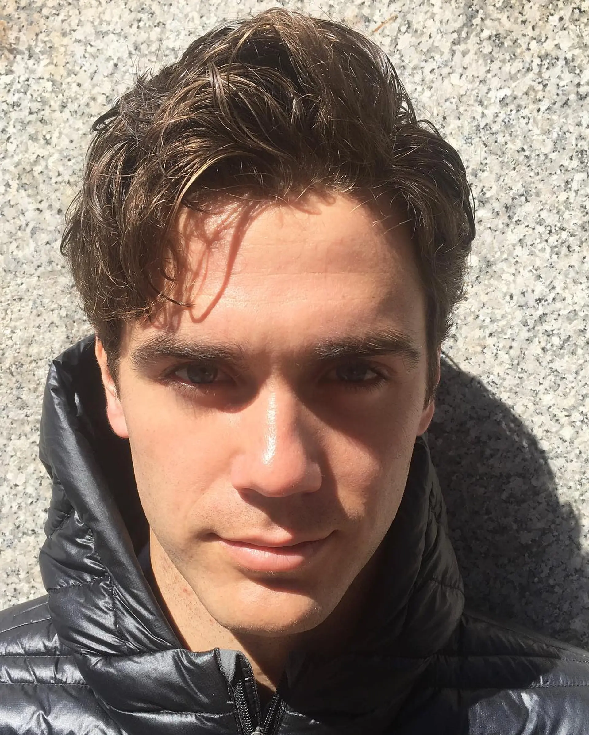 Short, wavy brown locks styled to create a casual, natural look with a layered cut and soft texture. 1