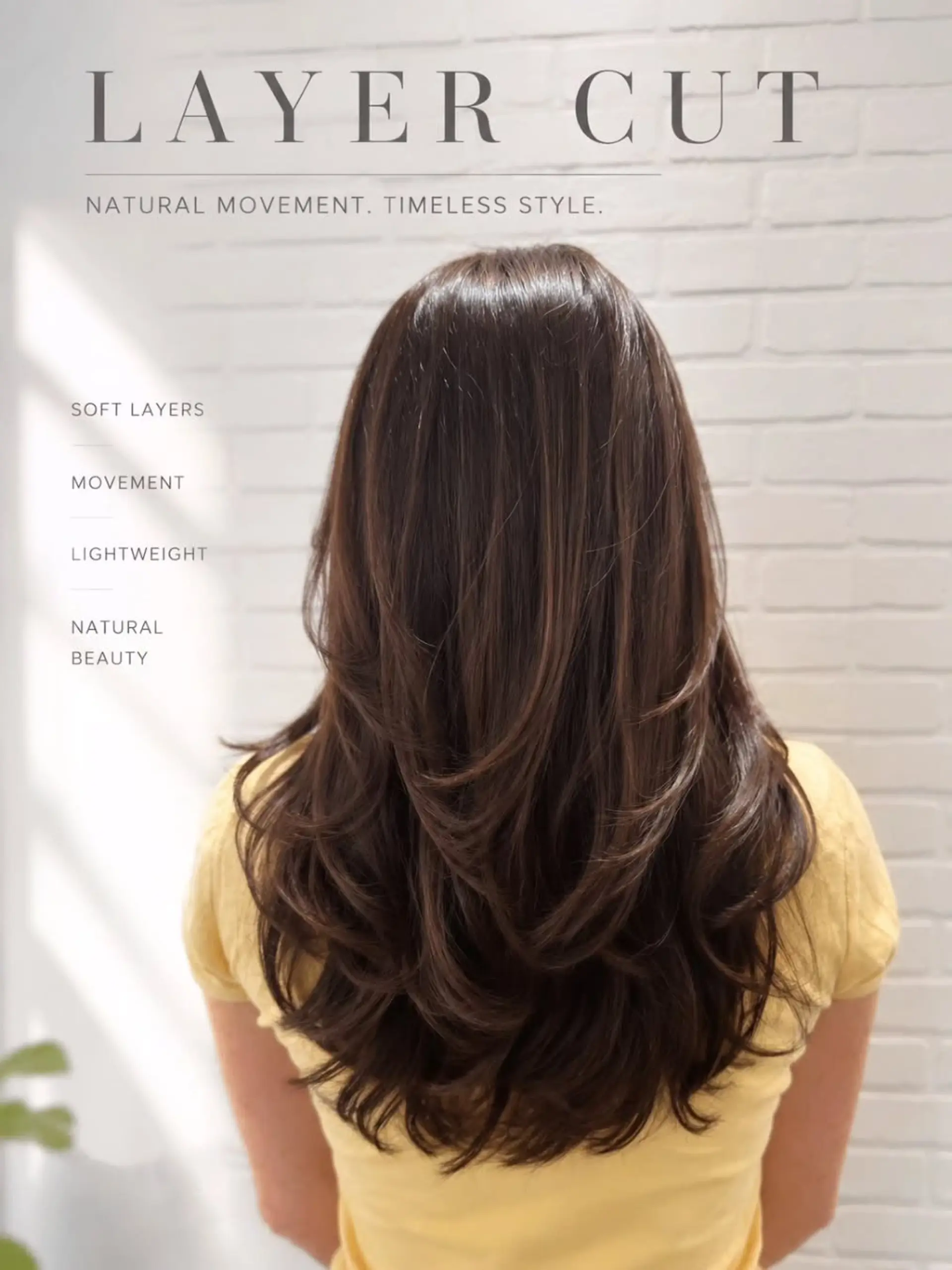 A long dark brown haircut cut with soft cascading layers and styled with bouncy, curved ends. 1