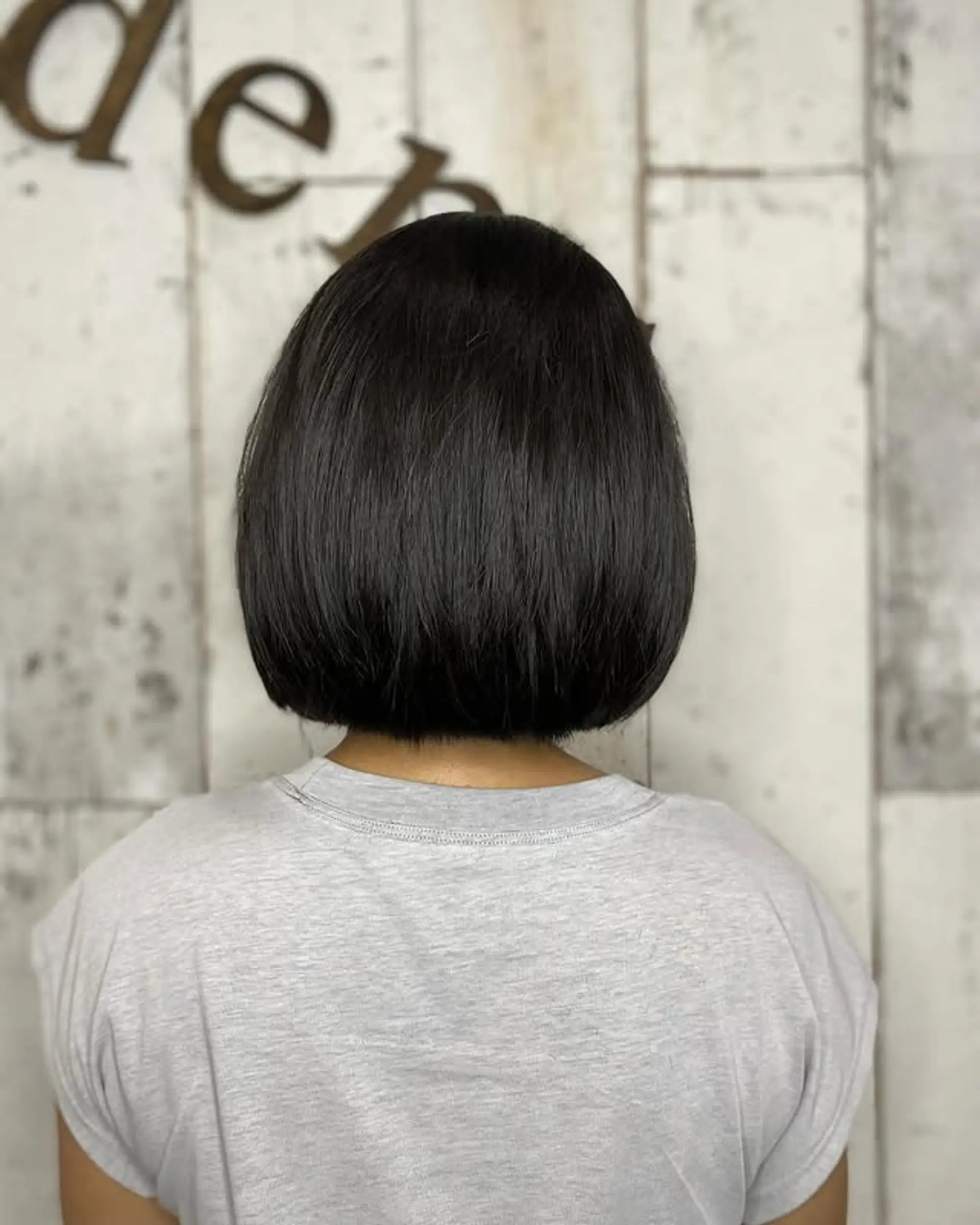 A sleek, chin-length bob with straight hair. 1