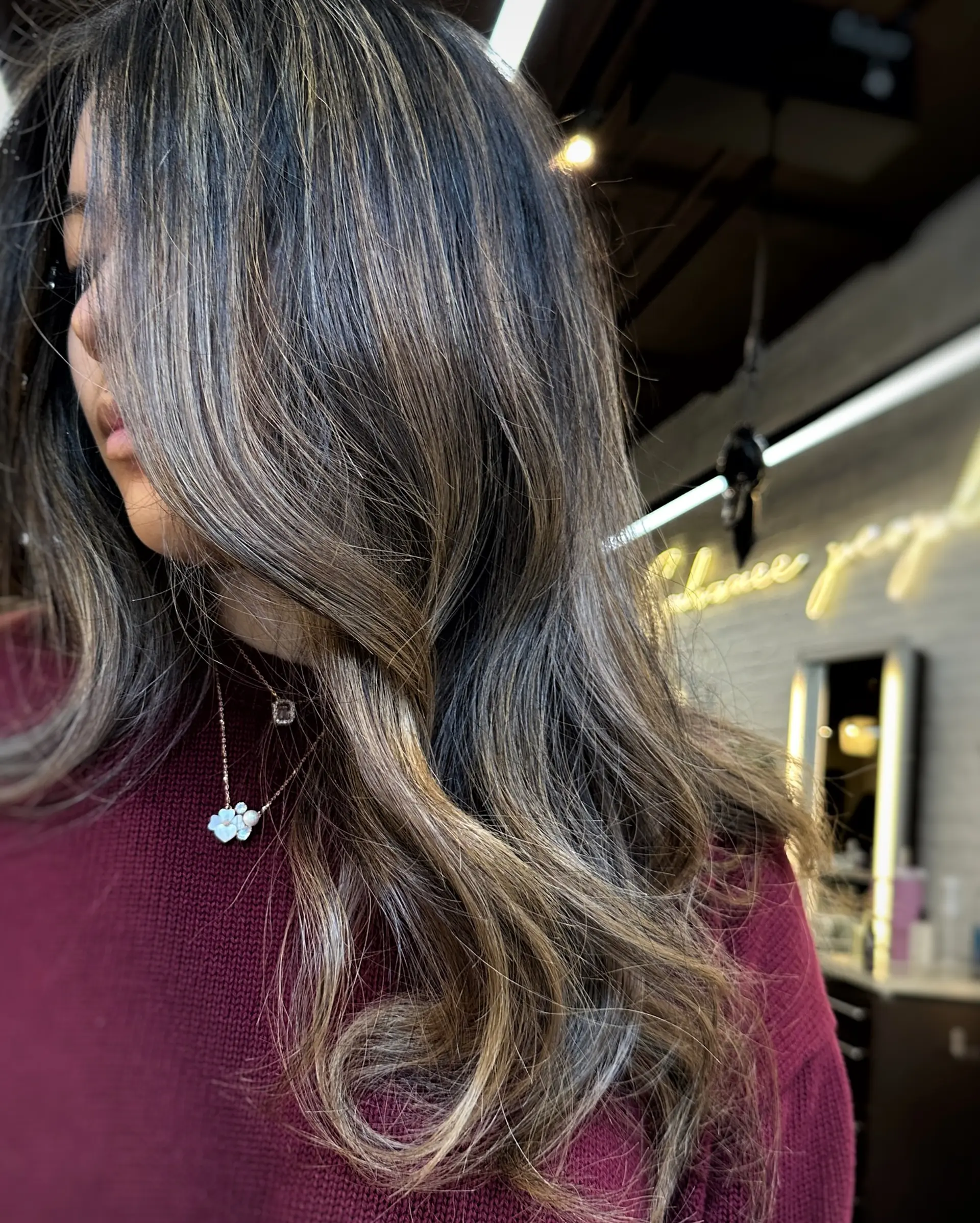 A long, straight hairstyle with a dimensional caramel ribbon balayage. 1