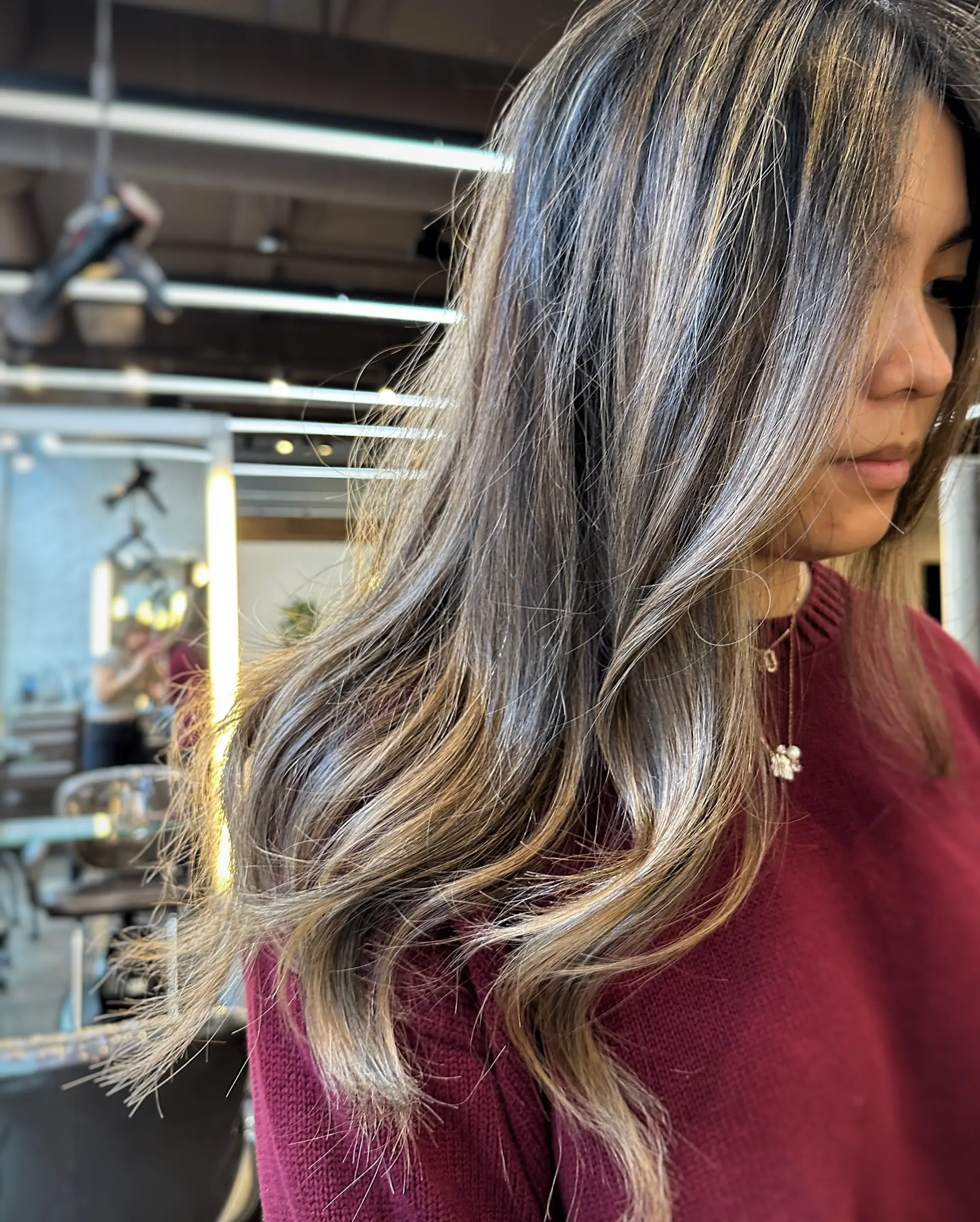 A long, straight hairstyle with a dimensional caramel ribbon balayage. 2