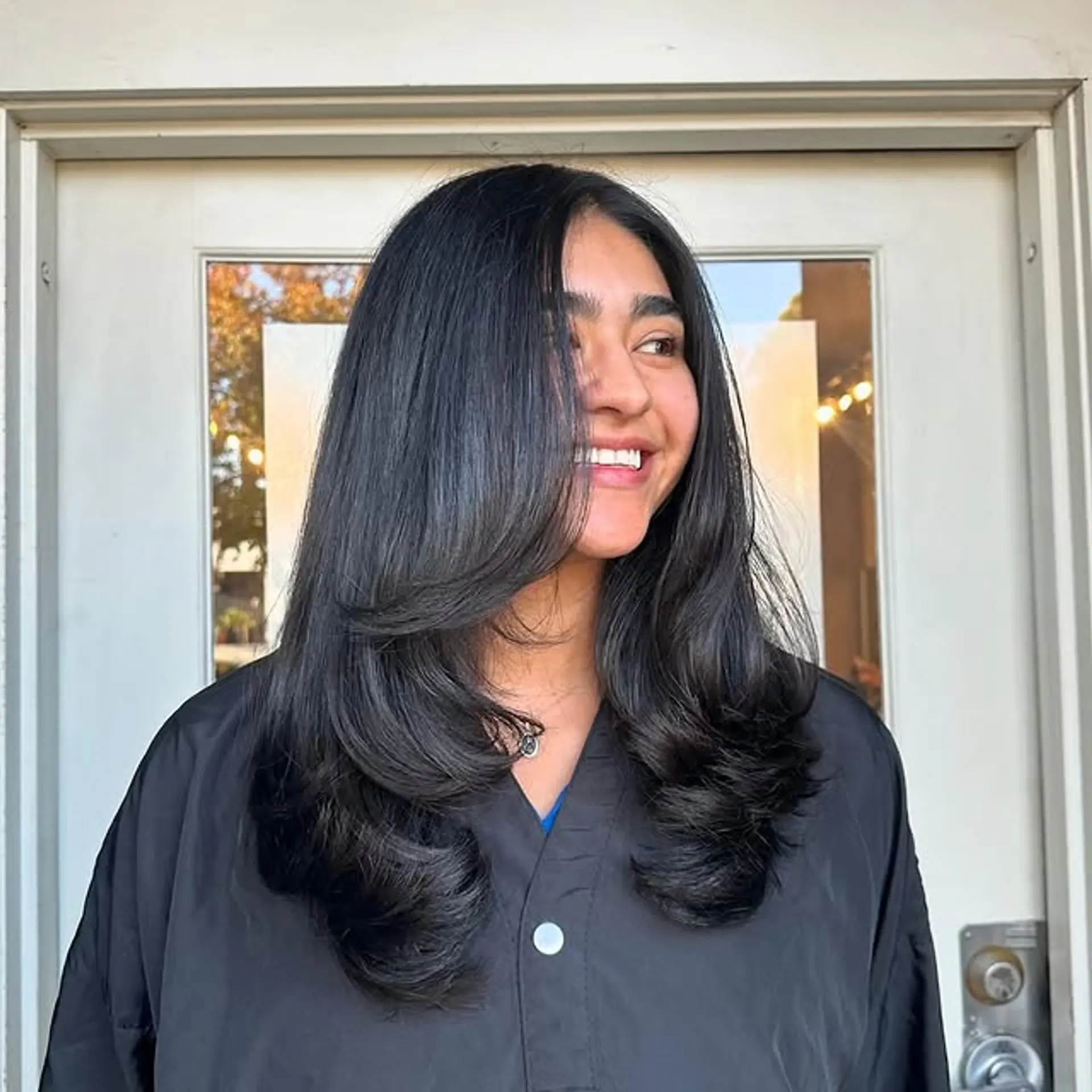 A long, layered haircut with face-framing layers. 1