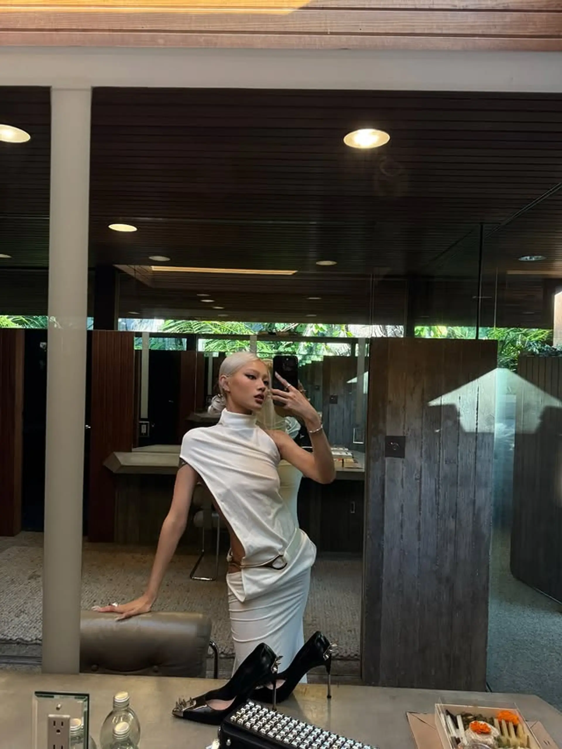 A sleek, high ponytail with a modern and icy platinum blonde color. 1