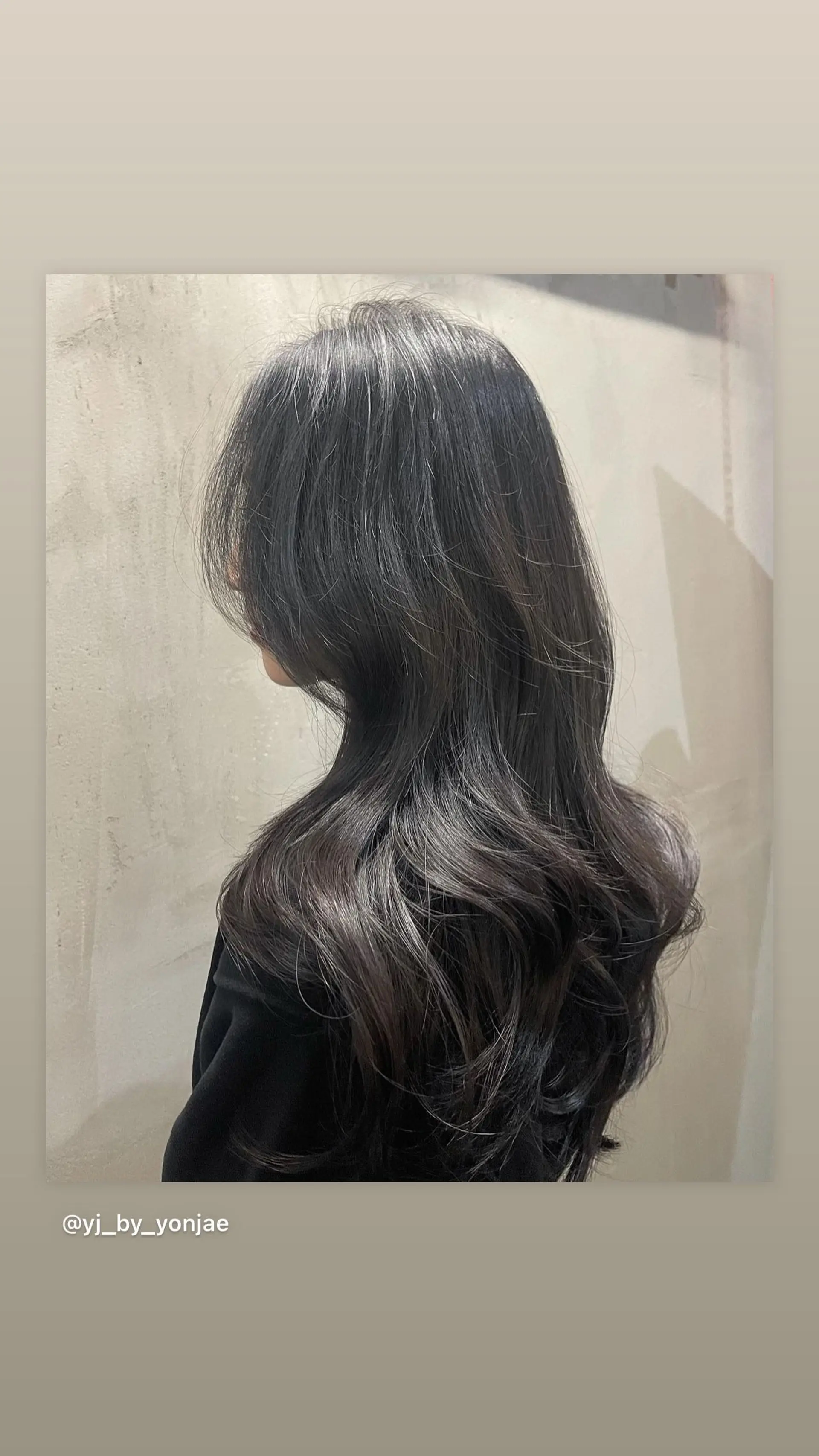 A layered long cut styled with soft, flowy waves and face-framing layers. 1