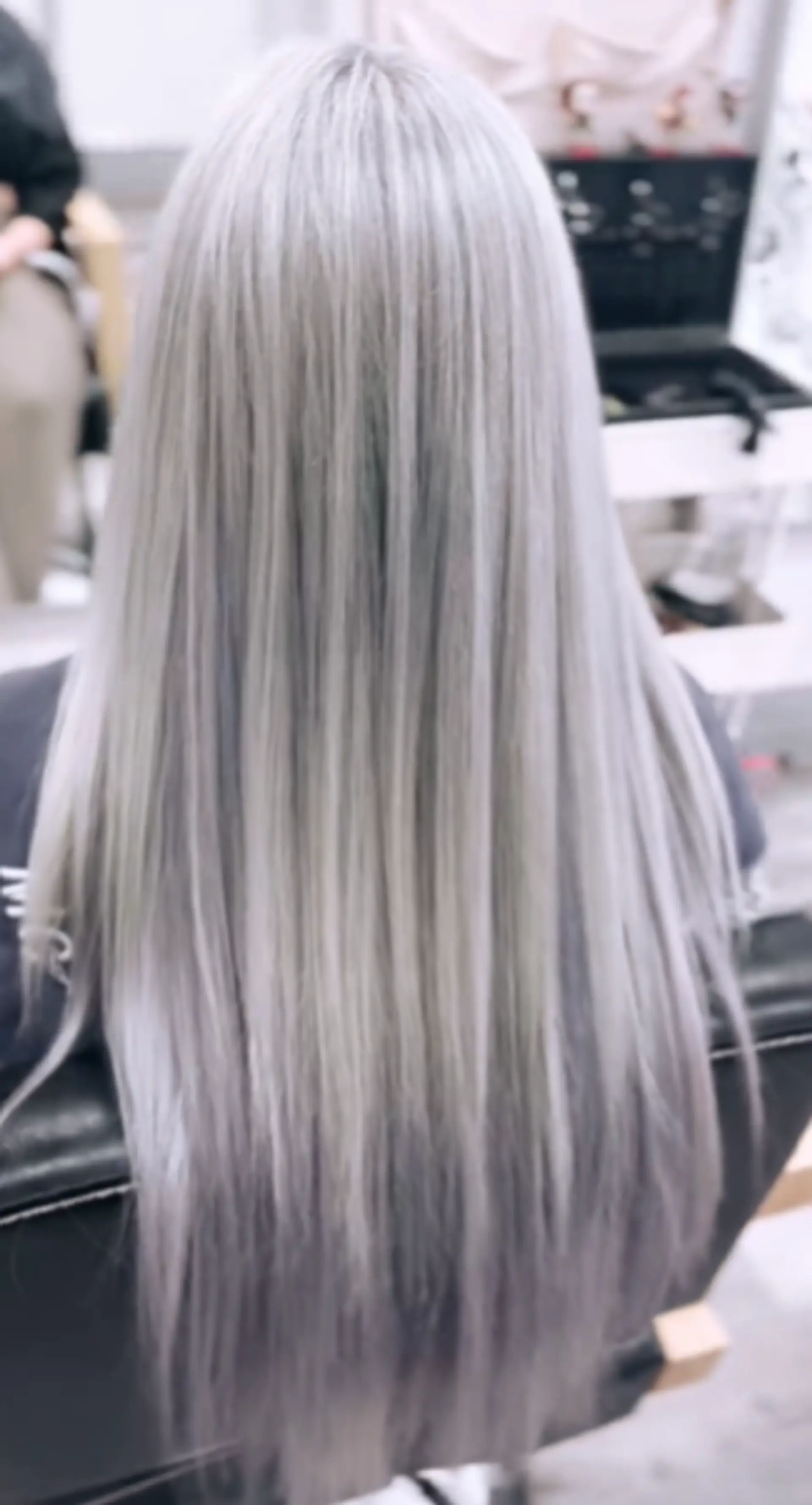 Very long, straight hair with a luxurious silver and platinum color, styled sleek and smooth into a seamless flow. 1