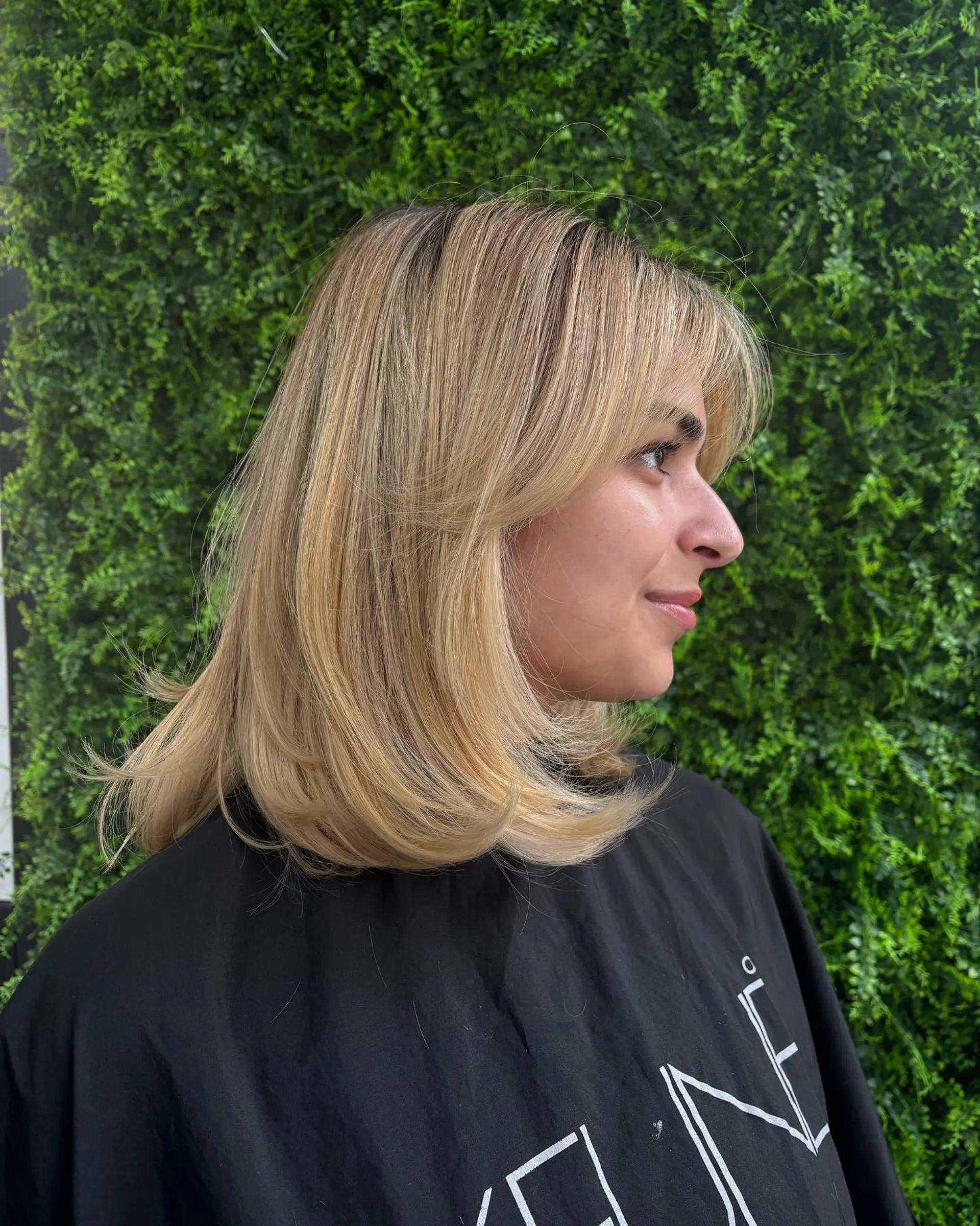 A layered lob with curtain bangs. 1