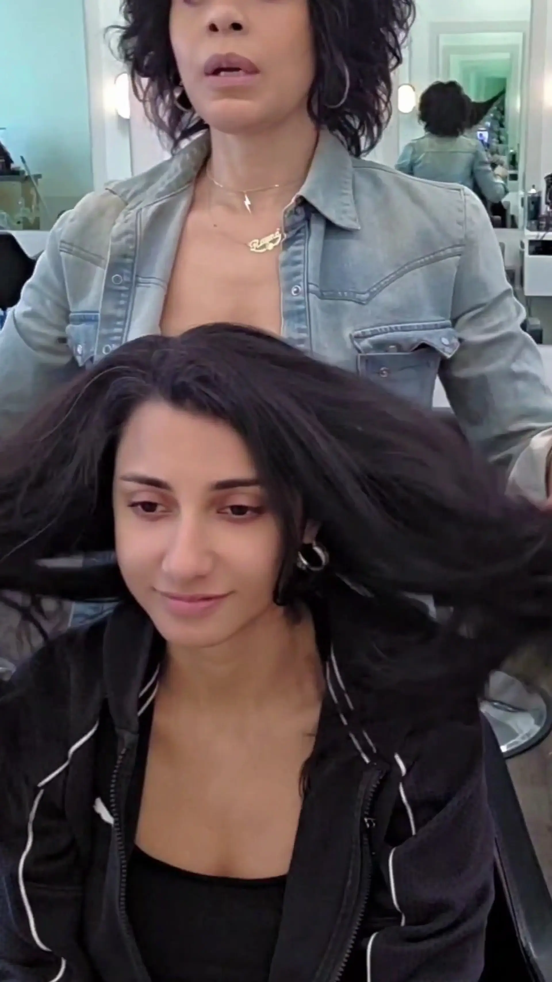 A full, voluminous blowout showcasing body, soft movement, and deep dark tones. 1