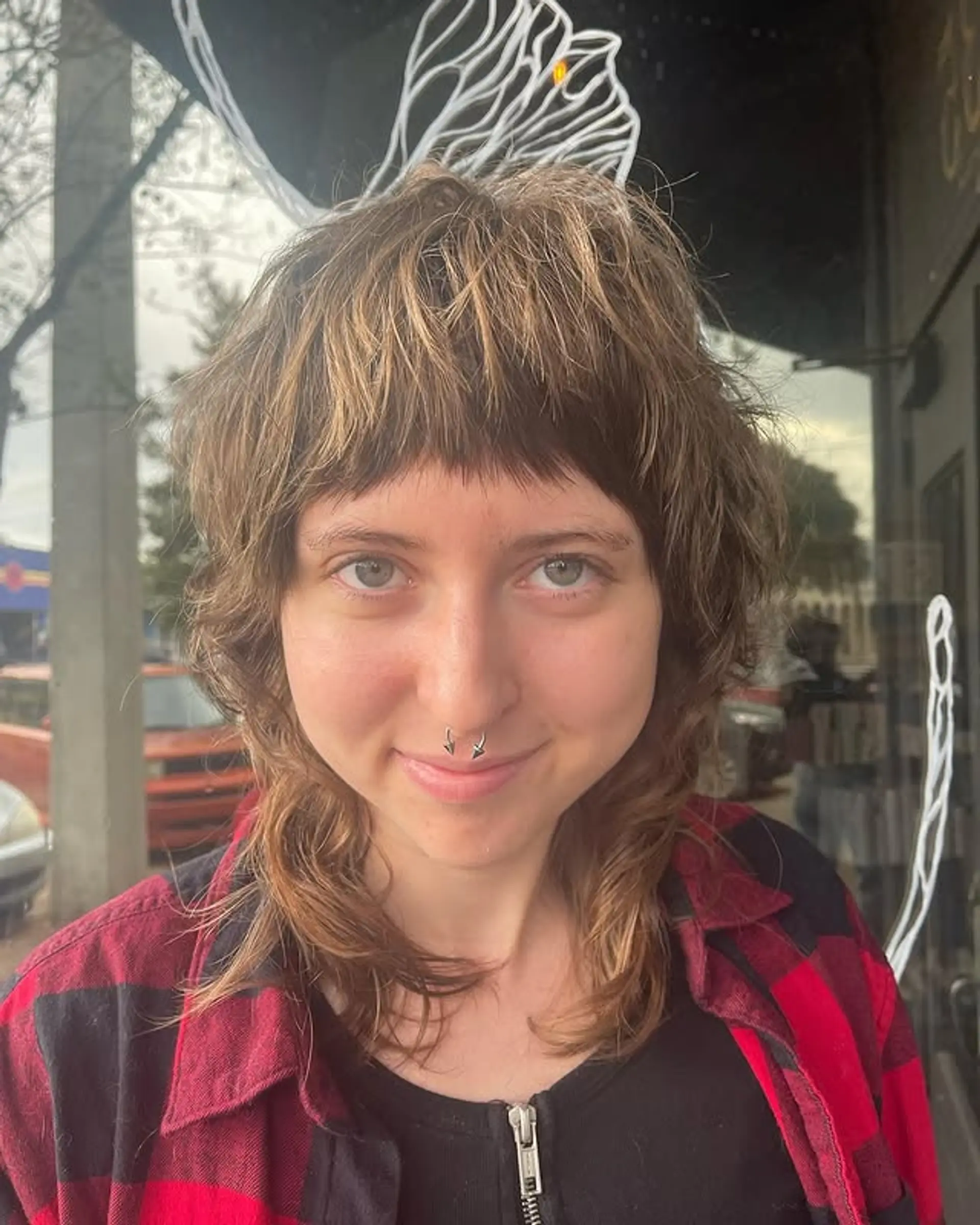 A modern shag with choppy layers and baby bangs. 1