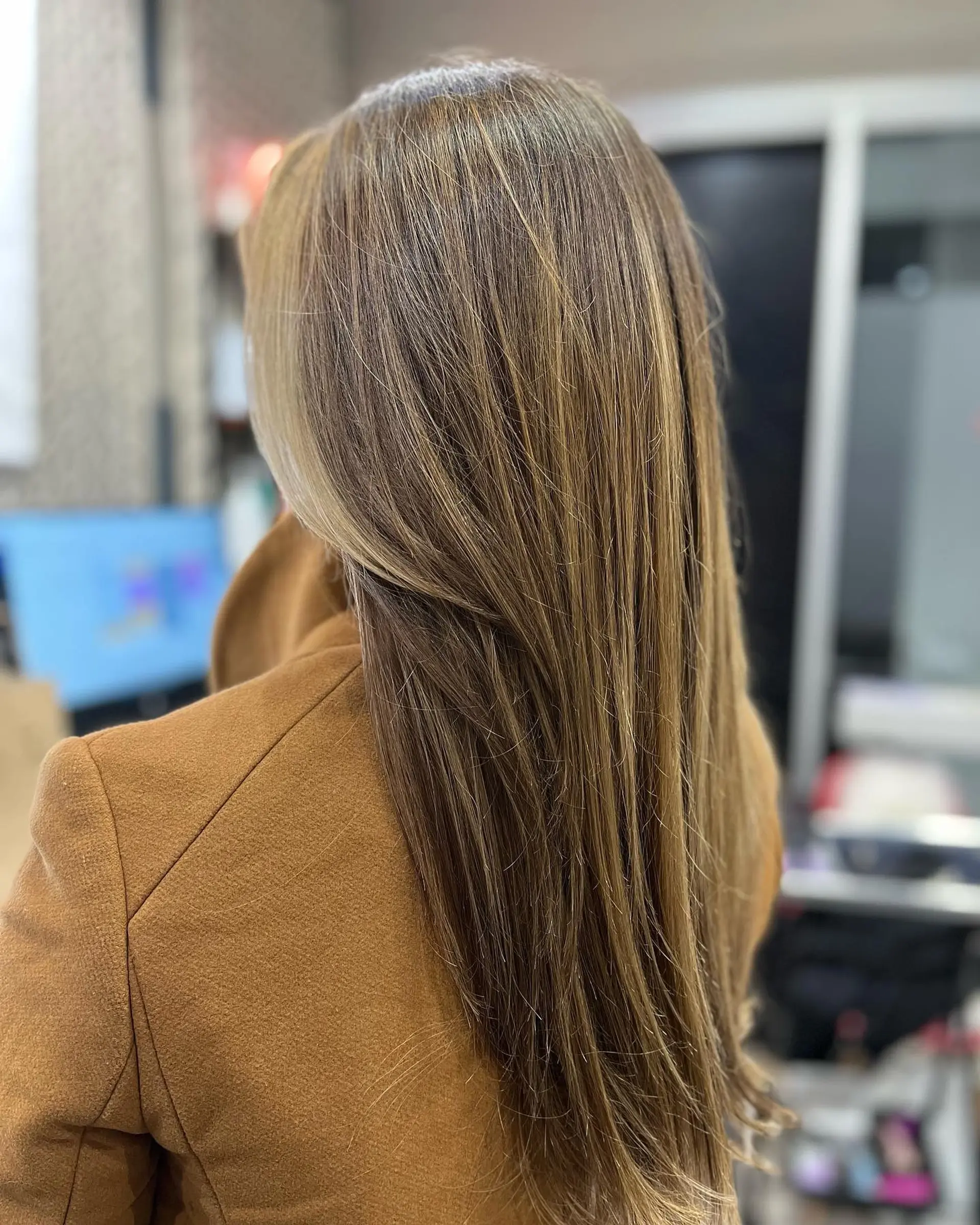 Long, layered straight hair with a honey blonde balayage. 1