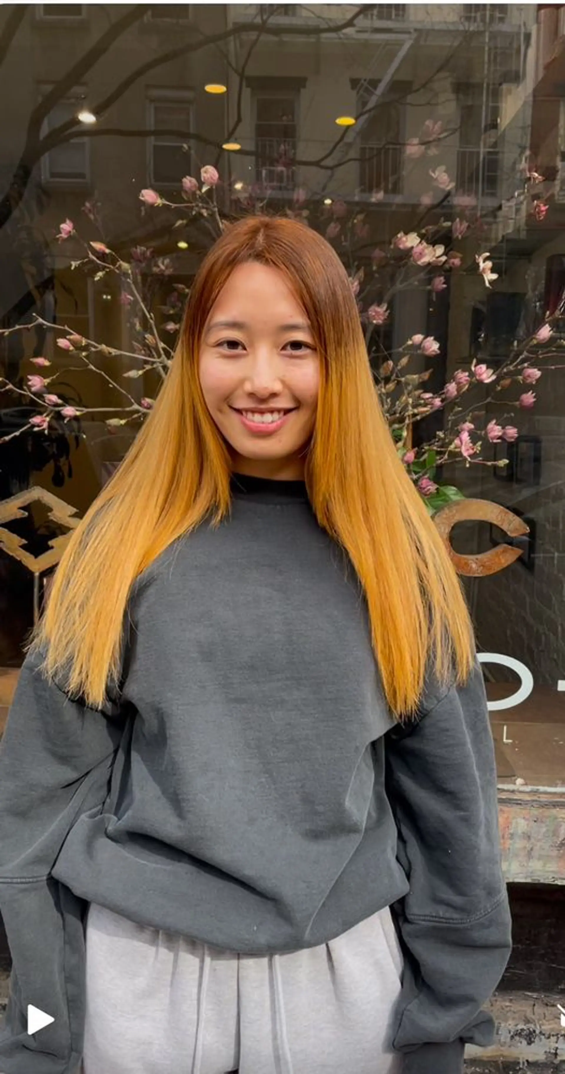 Long, layered hair with an ombre color transition from brown to copper to blonde. 1