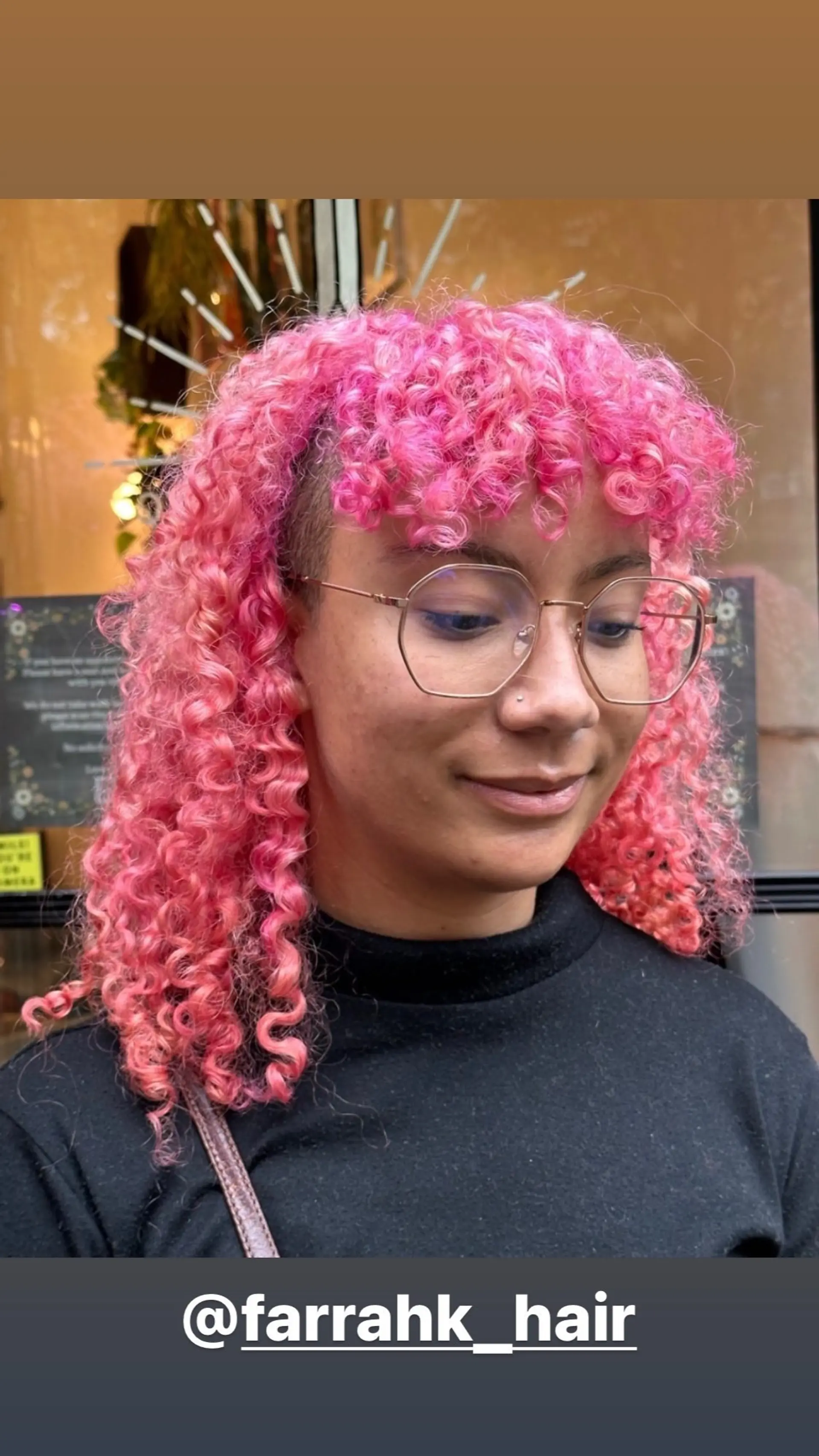 Medium length curly hairstyle with curly bangs and a vibrant color. 1