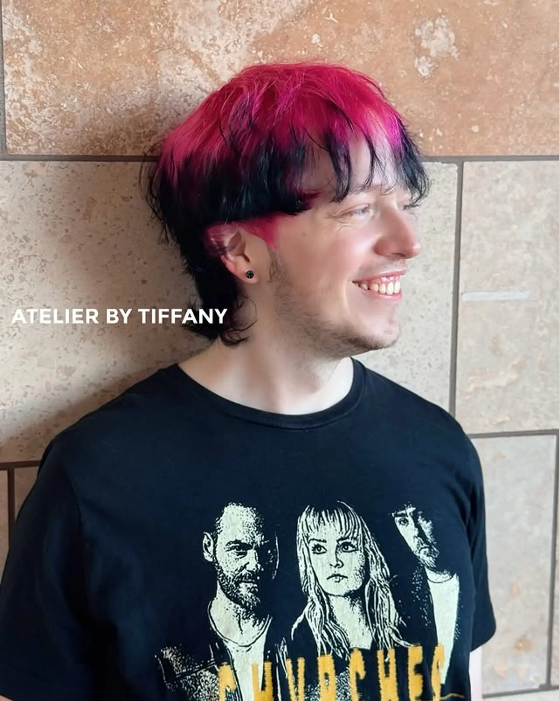 A modern mullet with black base and neon pink highlights. 1